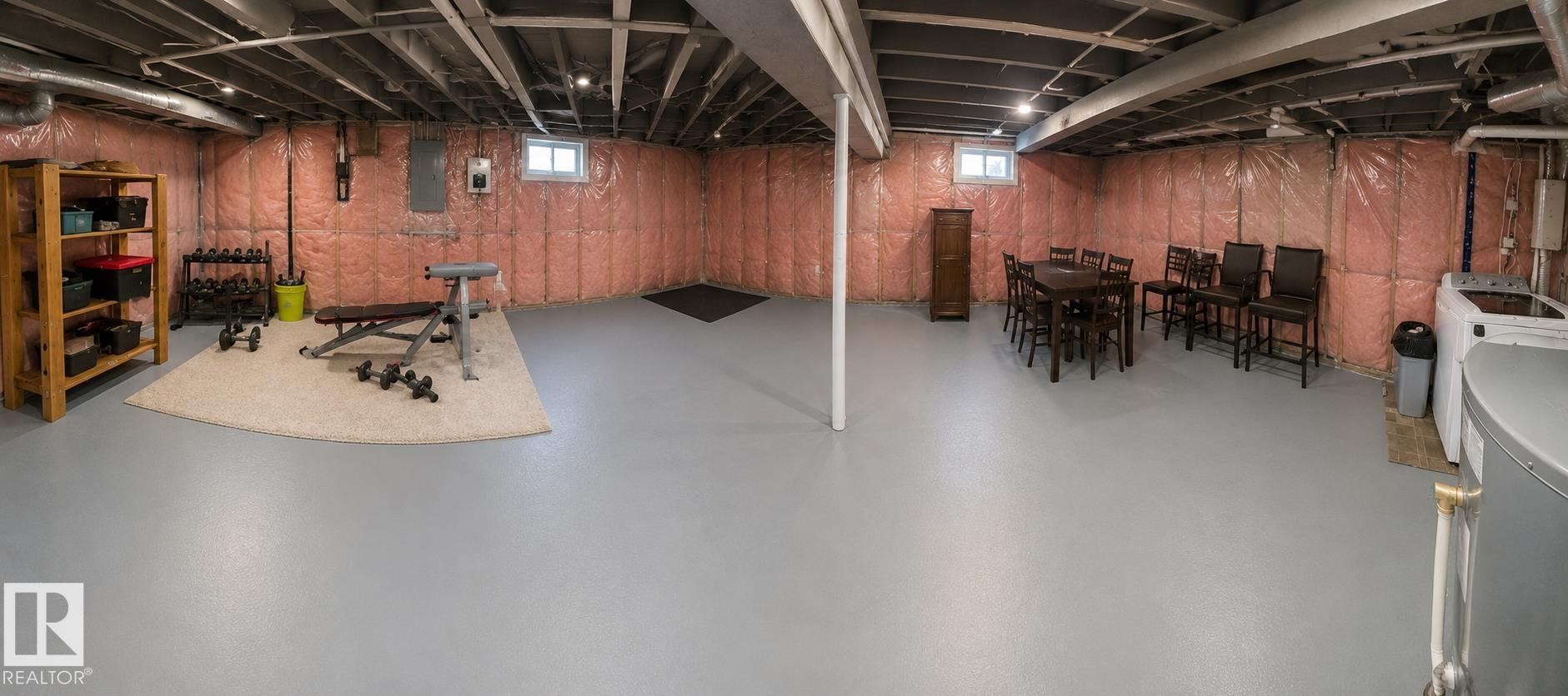 Unfinished basement with painted concrete flooring and exposed ceiling joists - 1022 106 Street Nw, Edmonton, AB - Indoor Photo Showing Basement