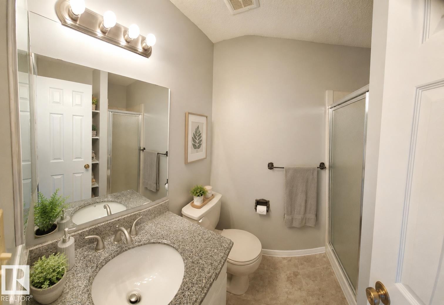Bathroom featuring a vanity with a granite-style countertop and an undermount sink - 1022 106 Street Nw, Edmonton, AB - Indoor Photo Showing Bathroom