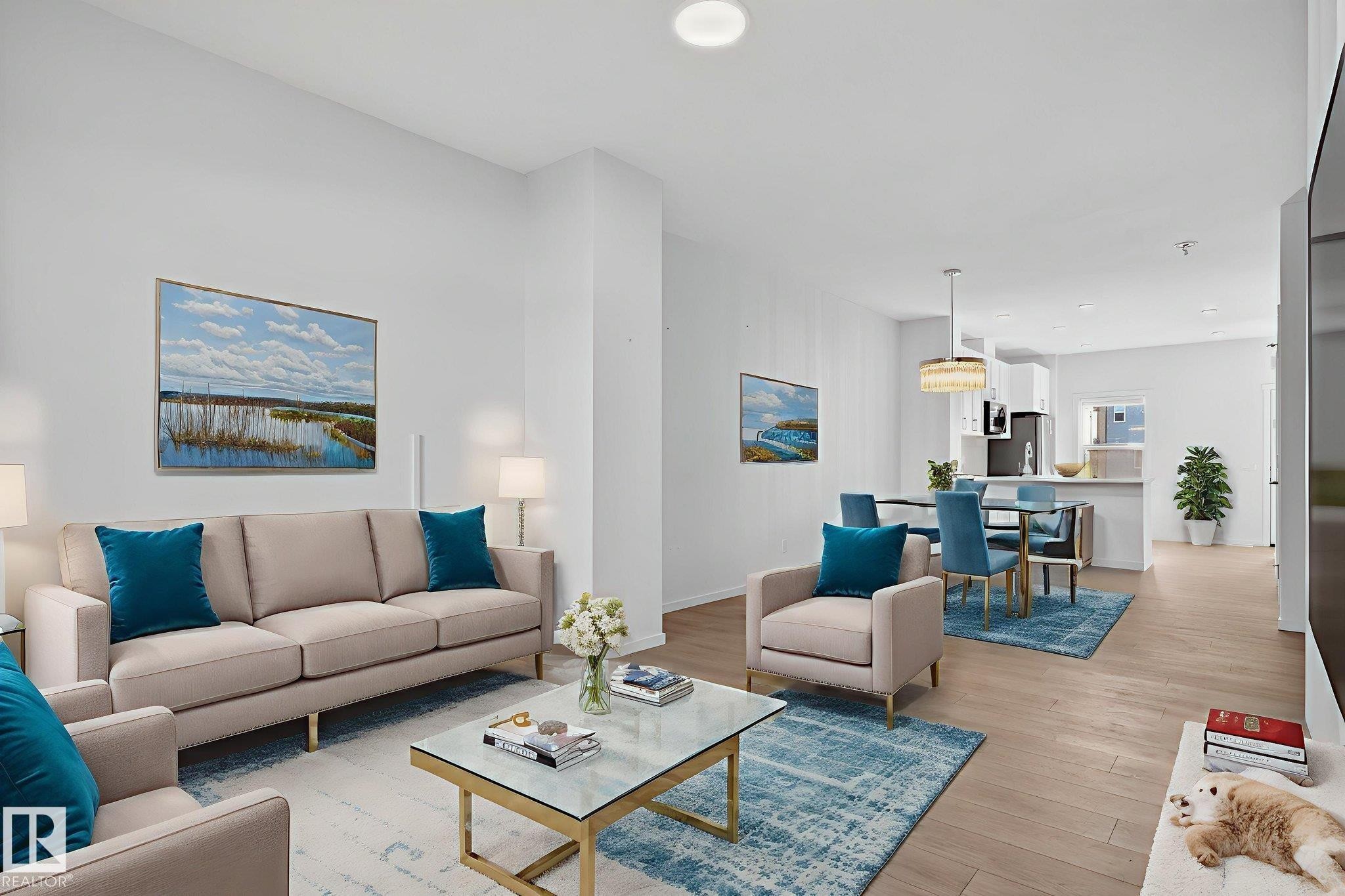 Open-concept living space featuring wood-finish flooring, recessed lighting, and a neutral color palette - 264 Orchards Boulevard Sw, Edmonton, AB - Indoor Photo Showing Living Room