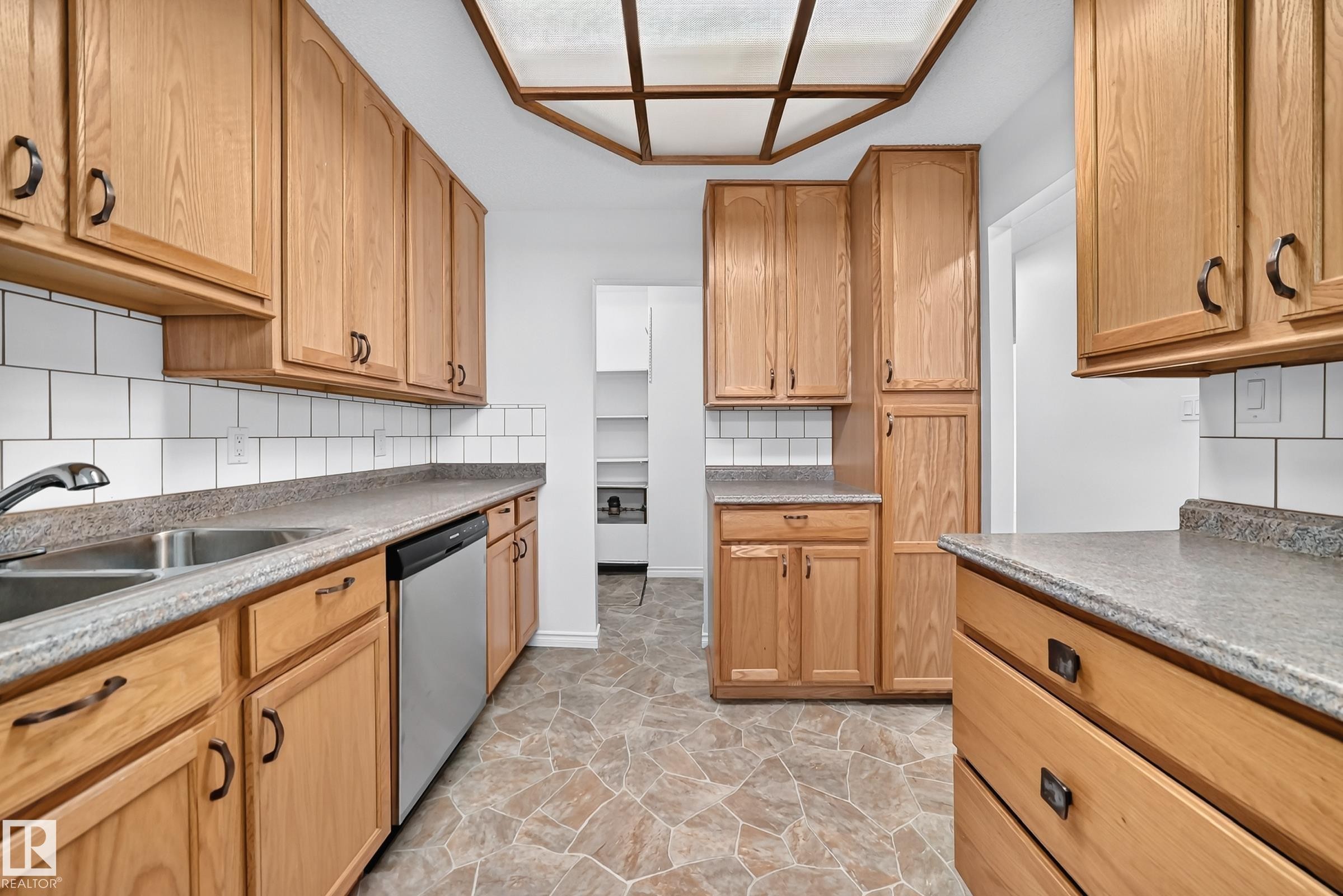 #40 3111 142 Av Nw, Edmonton, AB - Indoor Photo Showing Kitchen With Double Sink