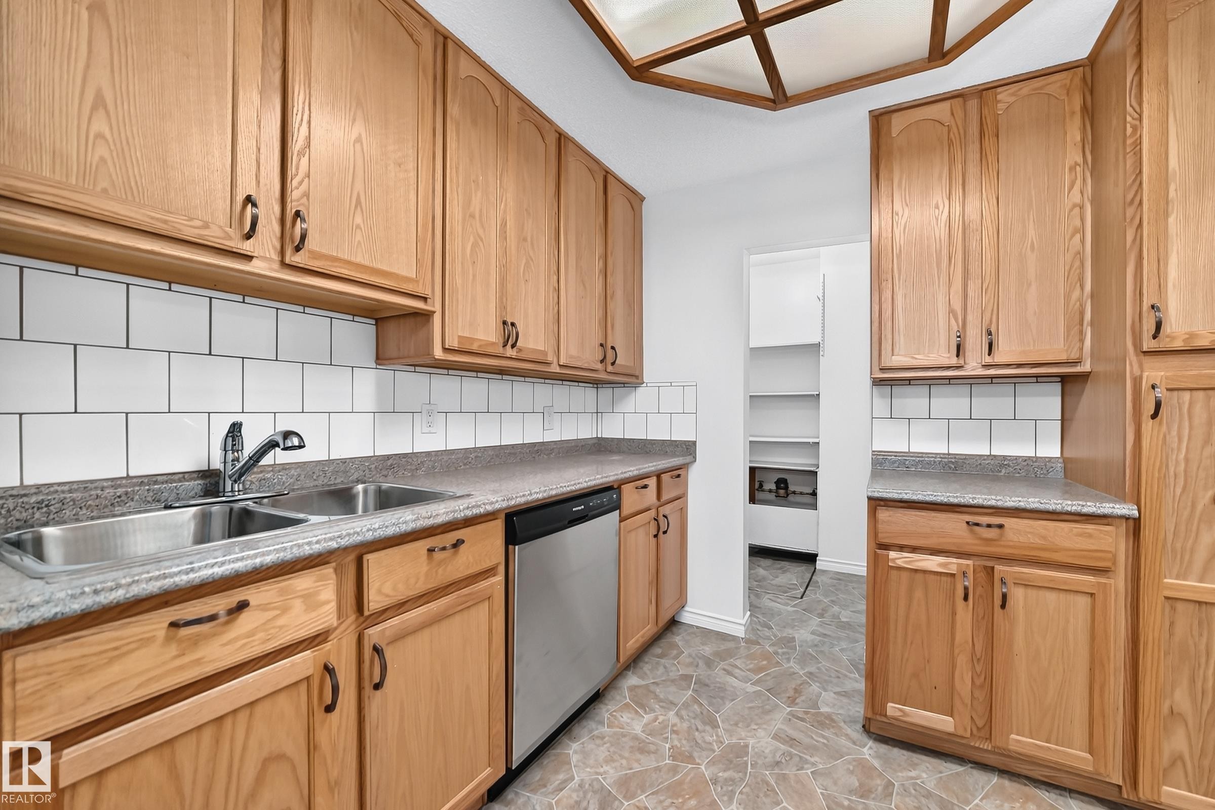 #40 3111 142 Av Nw, Edmonton, AB - Indoor Photo Showing Kitchen With Double Sink
