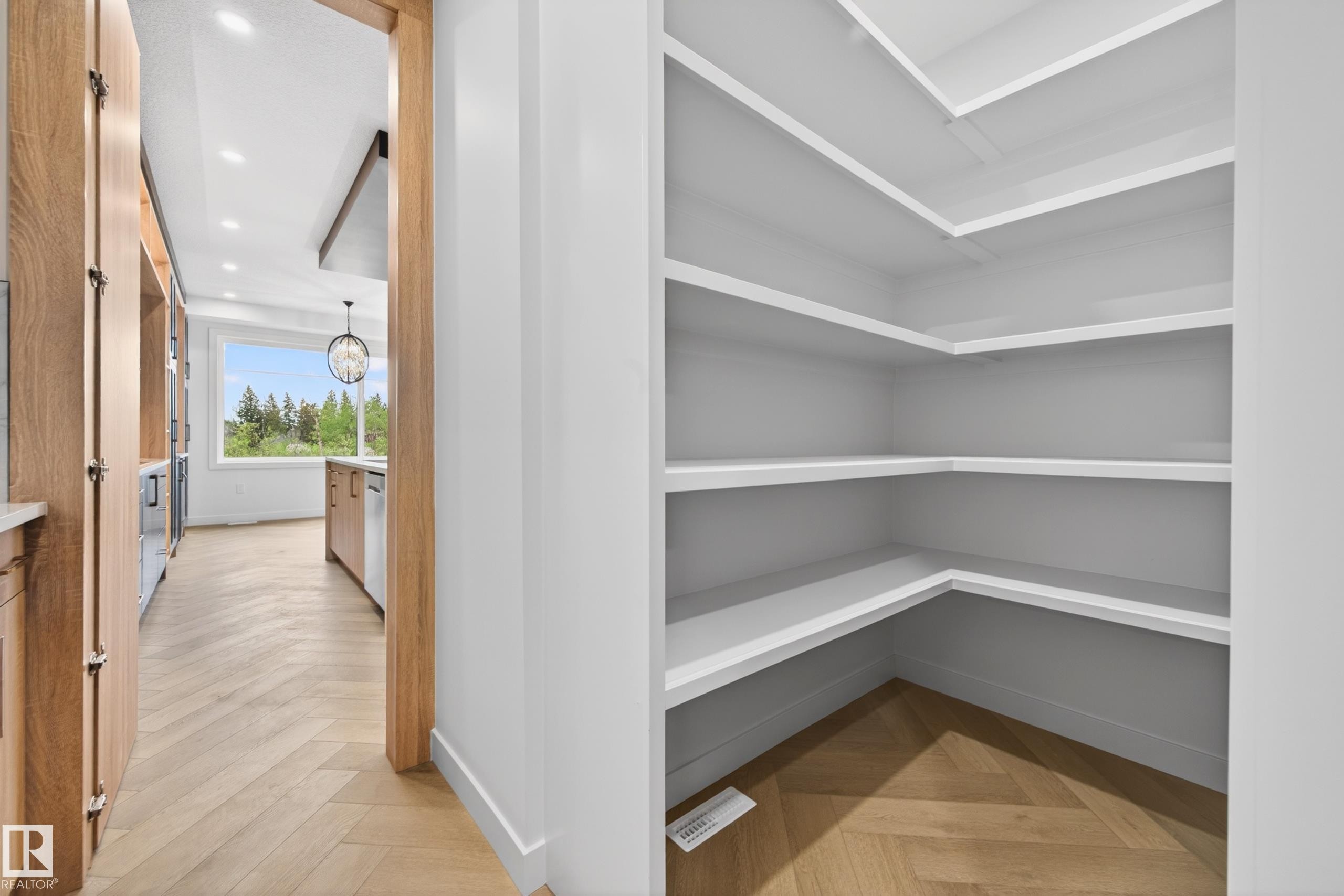Walk-in pantry with extensive shelving - 431 172 Avenue, Edmonton, AB - Indoor Photo Showing Other Room
