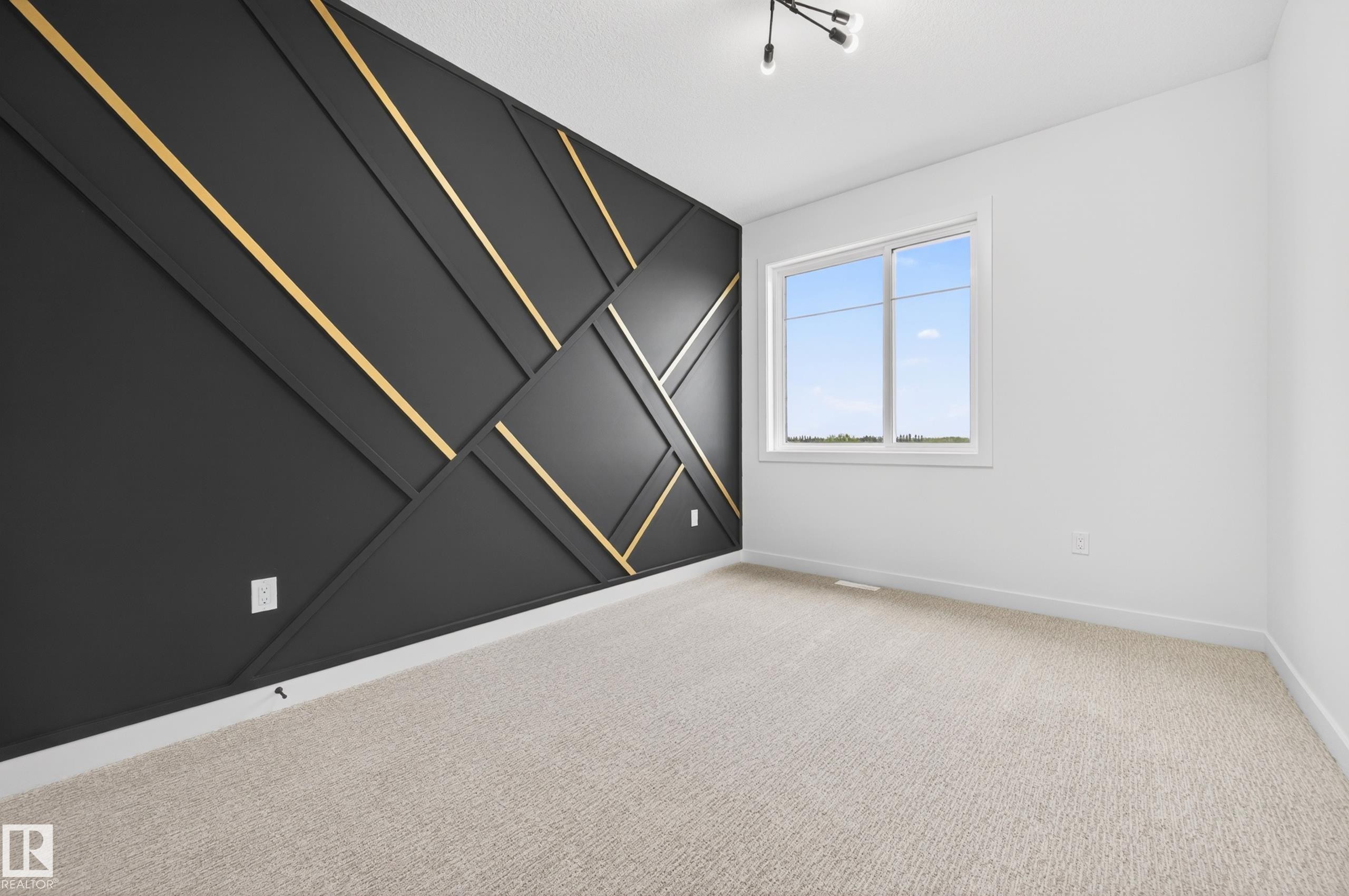 Feature wall with geometric black and gold paneling - 431 172 Avenue, Edmonton, AB - Indoor Photo Showing Other Room