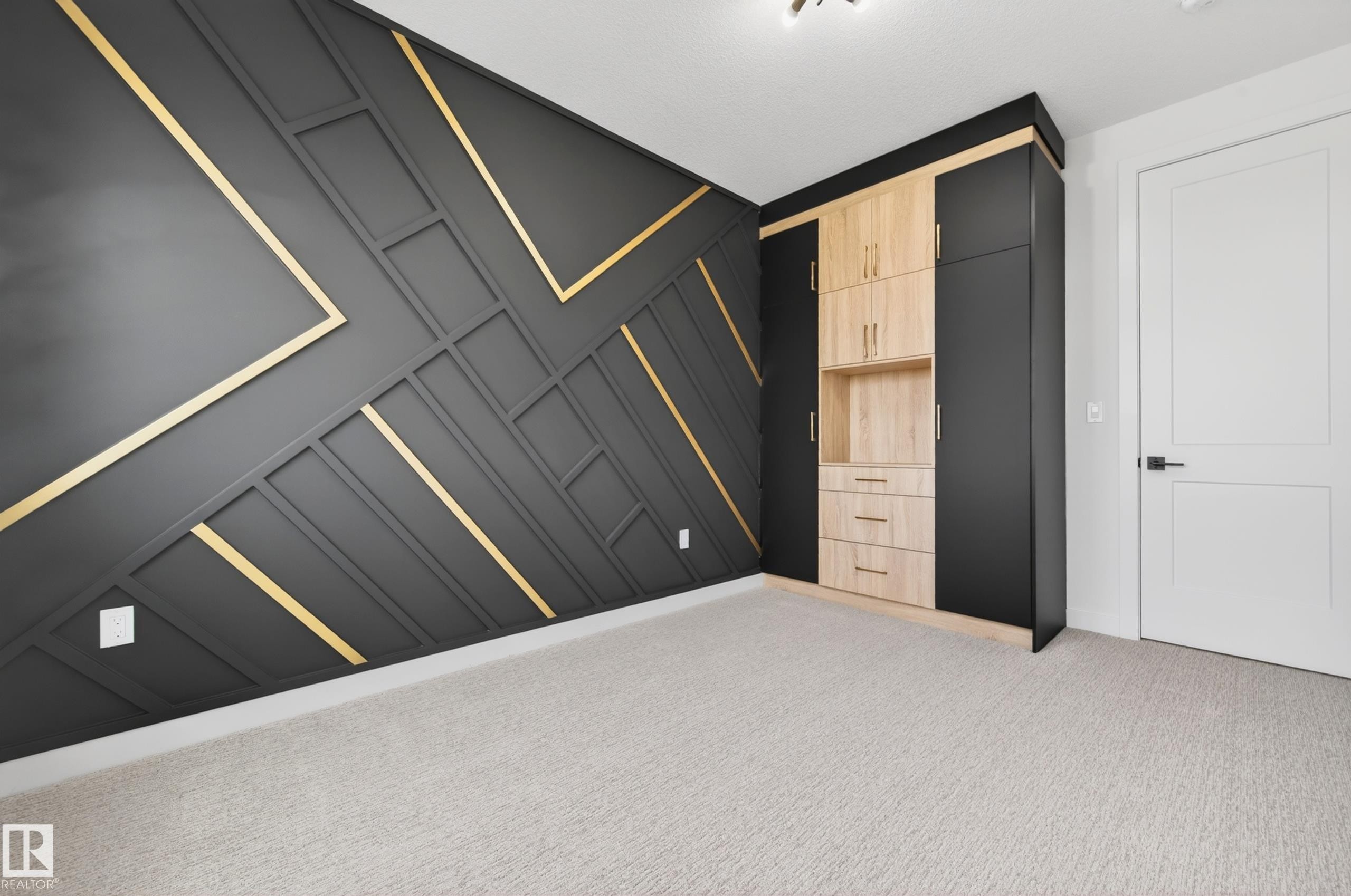 Accent wall featuring geometric paneling with gold trim - 431 172 Avenue, Edmonton, AB - Indoor Photo Showing Other Room