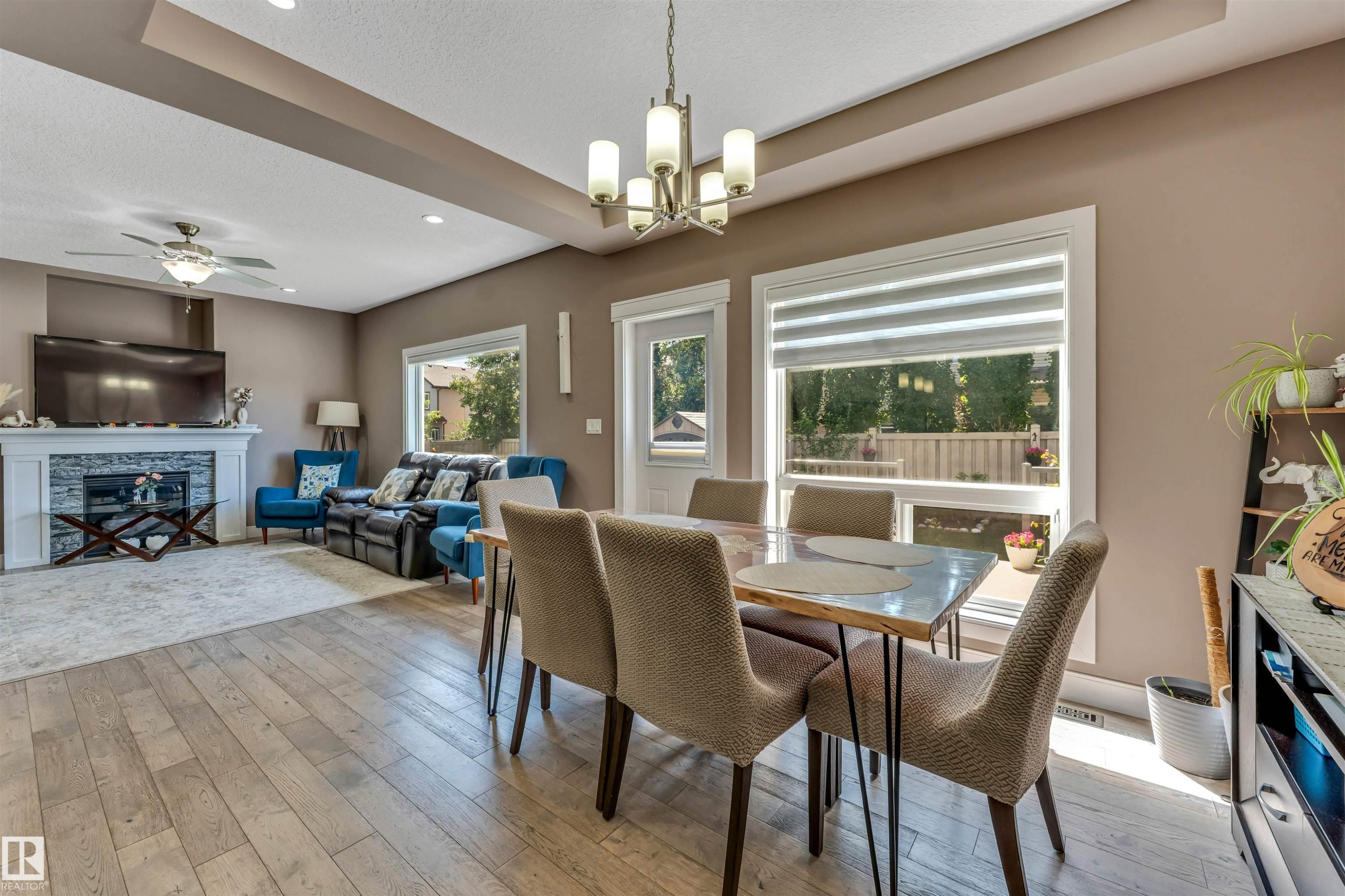 3819 Claxton Close Sw, Edmonton, AB - Indoor Photo Showing Dining Room With Fireplace