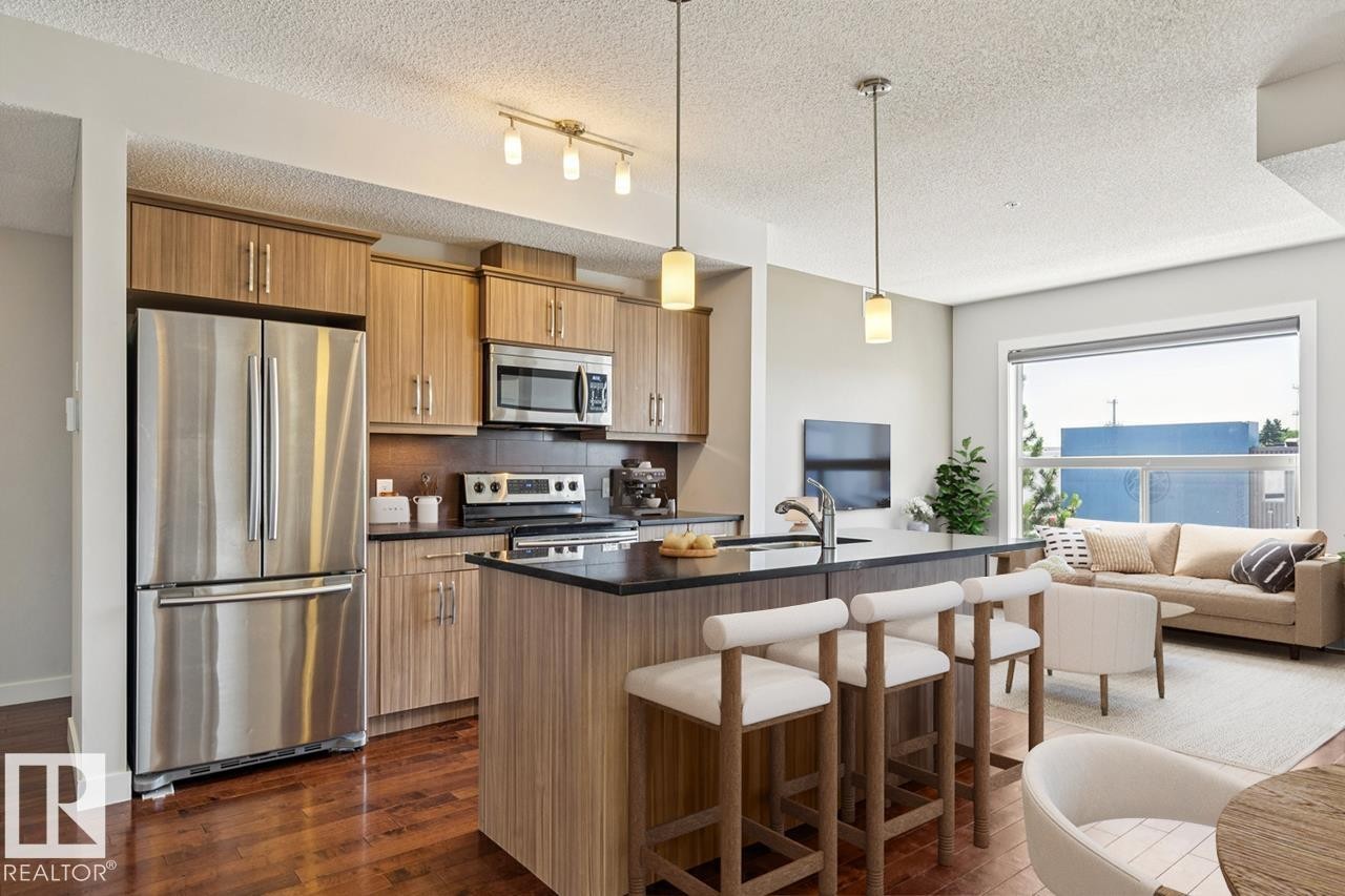 #217 10523 123 St Nw, Edmonton, AB - Indoor Photo Showing Kitchen With Stainless Steel Kitchen