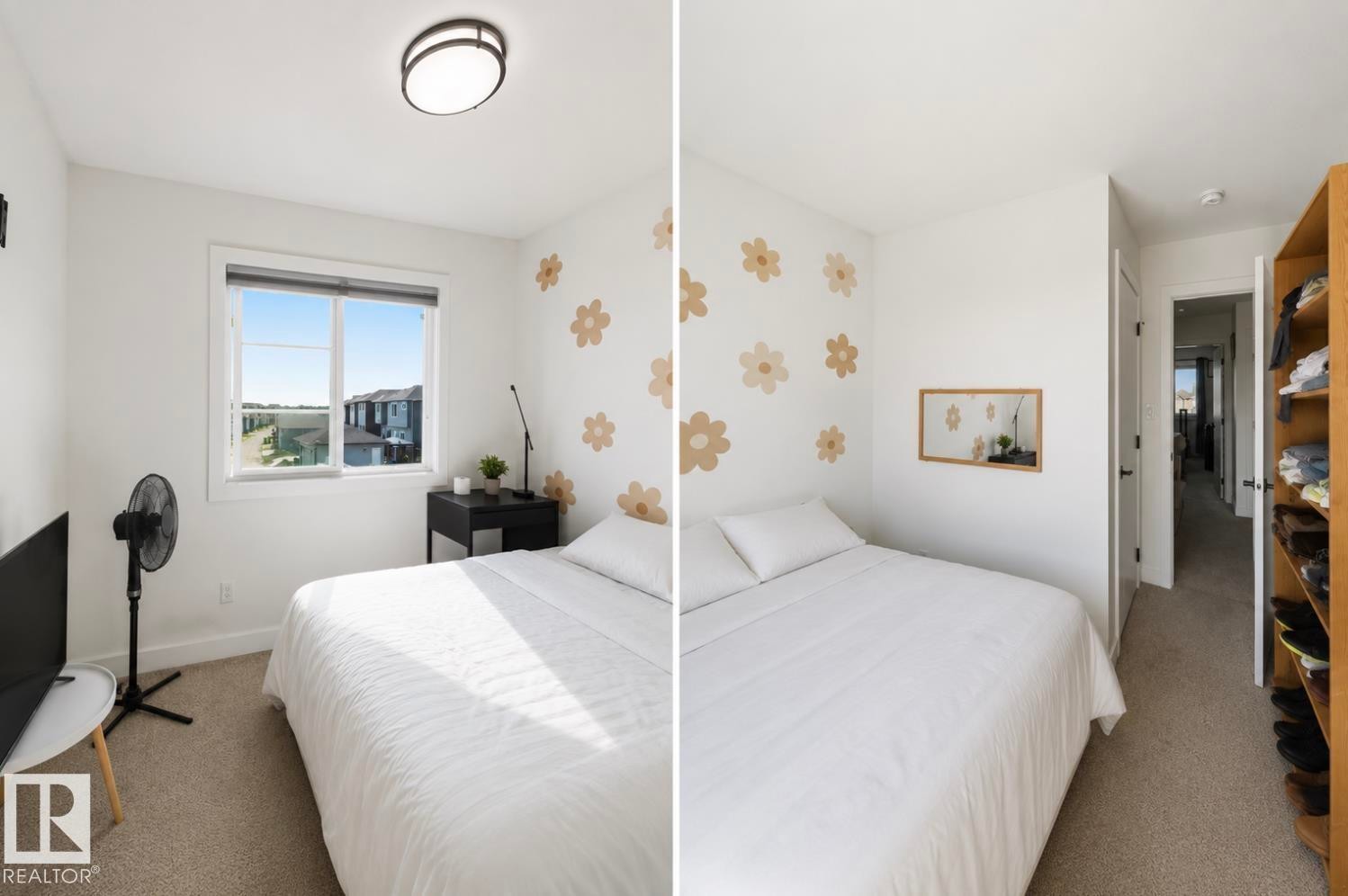 Bedroom featuring neutral carpeting, a large window, a ceiling-mounted light fixture, and a built-in open shelving unit - 17924 61 Street Nw, Edmonton, AB - Indoor Photo Showing Bedroom
