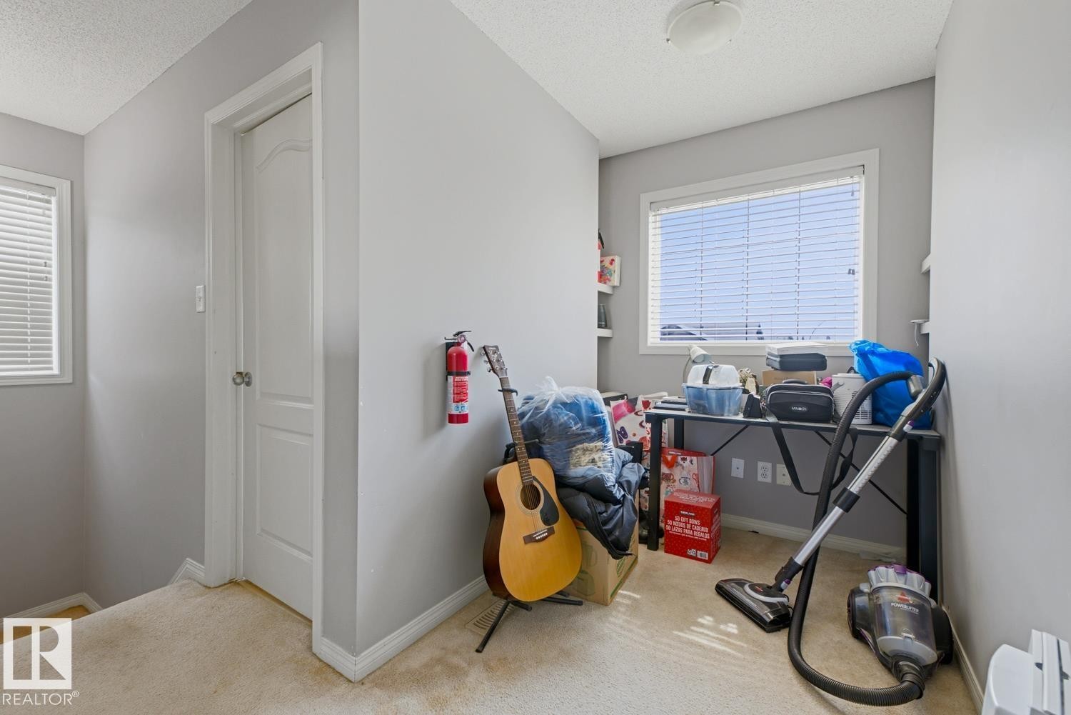 Interior space featuring light gray walls, white trim, and neutral carpeting - 3724 163 Avenue Nw, Edmonton, AB - Indoor Photo Showing Other Room