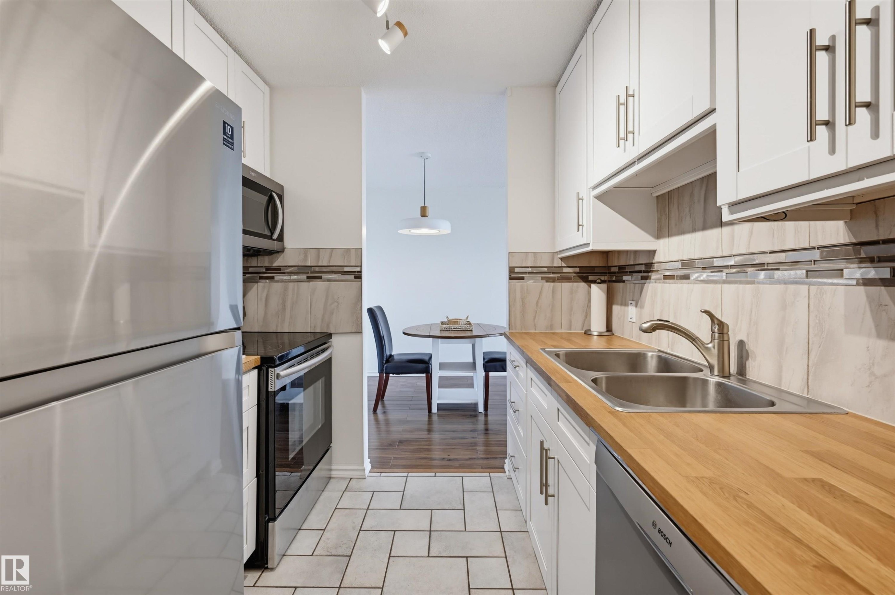 #709 11307 99 Av Nw, Edmonton, AB - Indoor Photo Showing Kitchen With Double Sink