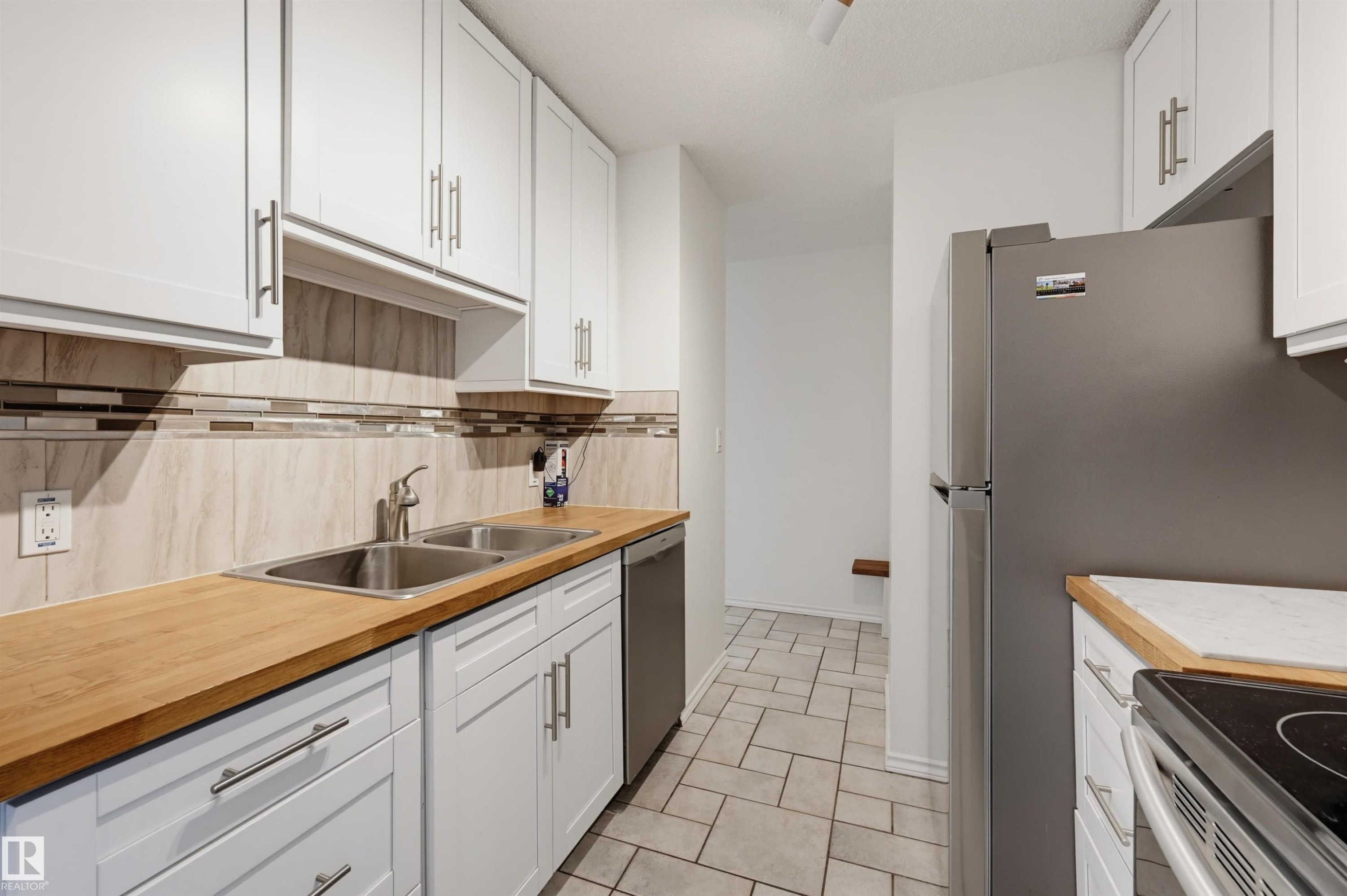 #709 11307 99 Av Nw, Edmonton, AB - Indoor Photo Showing Kitchen With Double Sink
