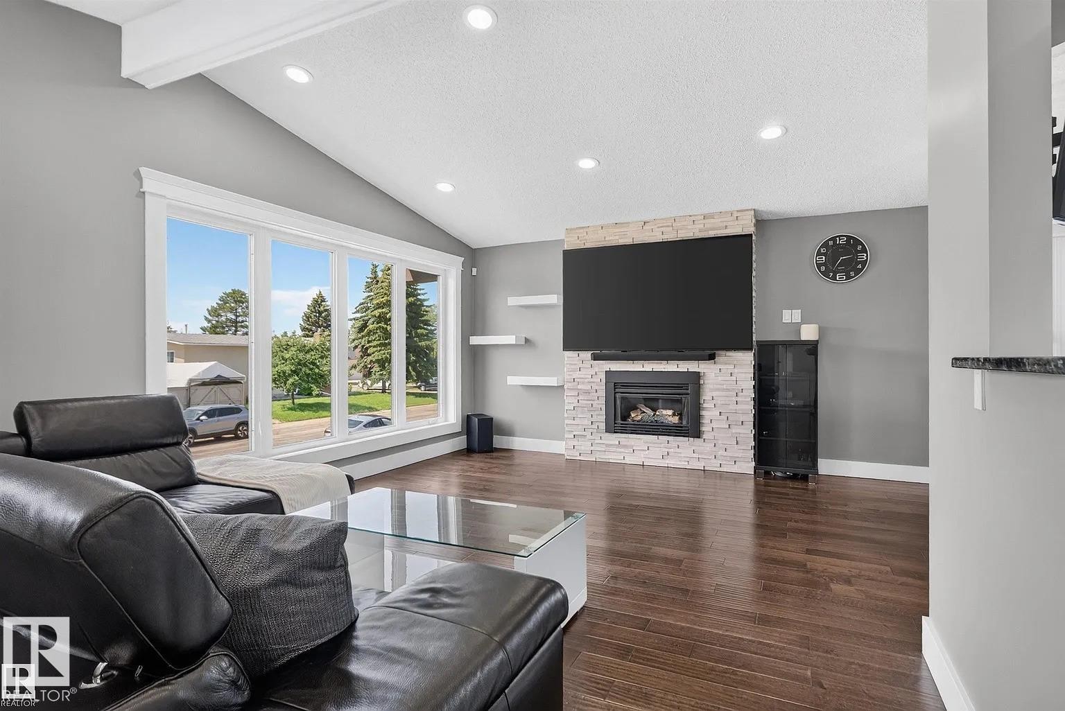 3911 67 Street Nw, Edmonton, AB - Indoor Photo Showing Living Room With Fireplace