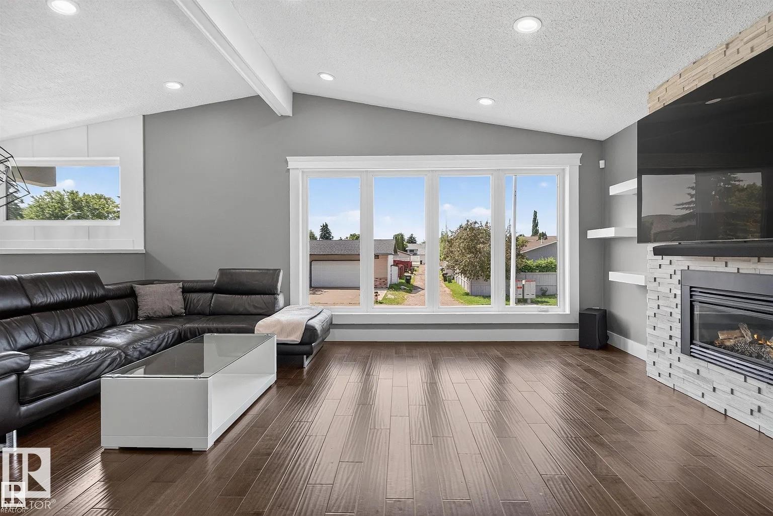 3911 67 Street Nw, Edmonton, AB - Indoor Photo Showing Living Room With Fireplace