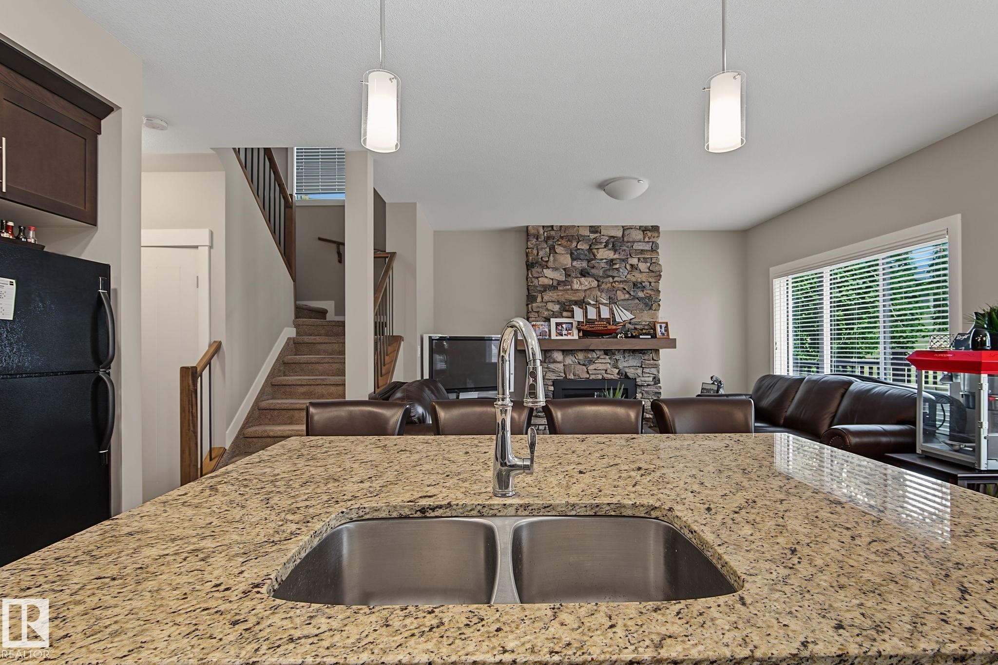 8005 223 Street Nw, Edmonton, AB - Indoor Photo Showing Kitchen With Fireplace With Double Sink With Upgraded Kitchen