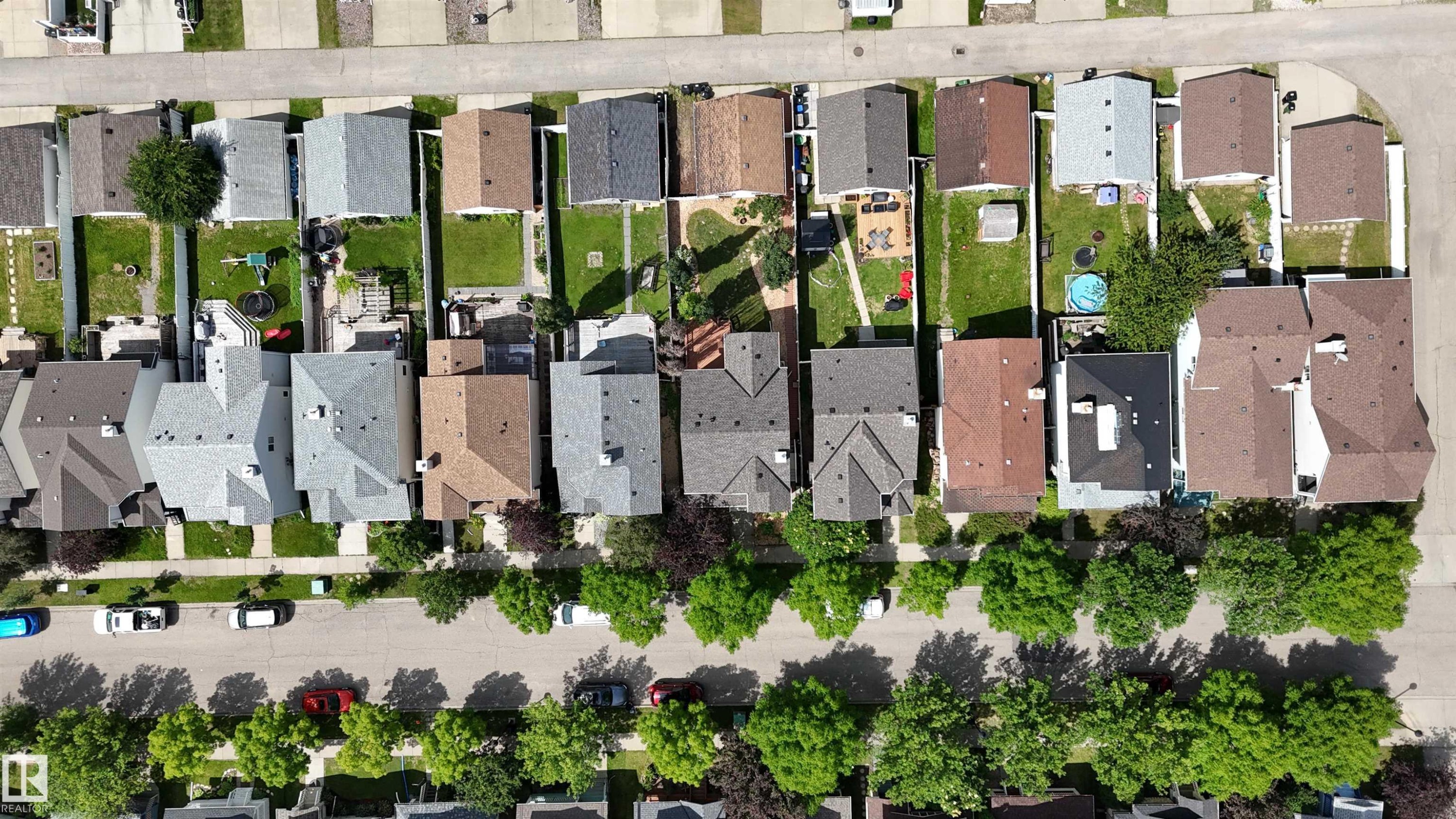 Aerial perspective showcasing a residential neighborhood with varied architectural styles - 1686 Tompkins Wynd Nw, Edmonton, AB -