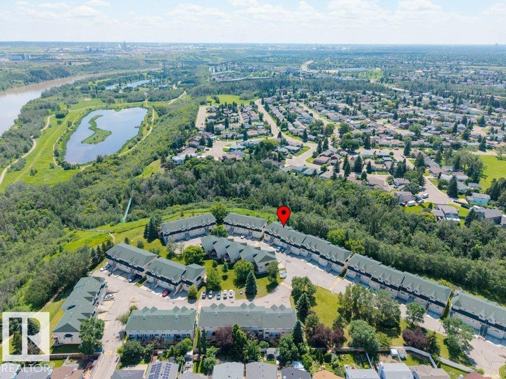 Aerial perspective showcasing a community of townhome-style residences with green roofs - #39 2419 133 Av Nw, Edmonton, AB - Outdoor With View