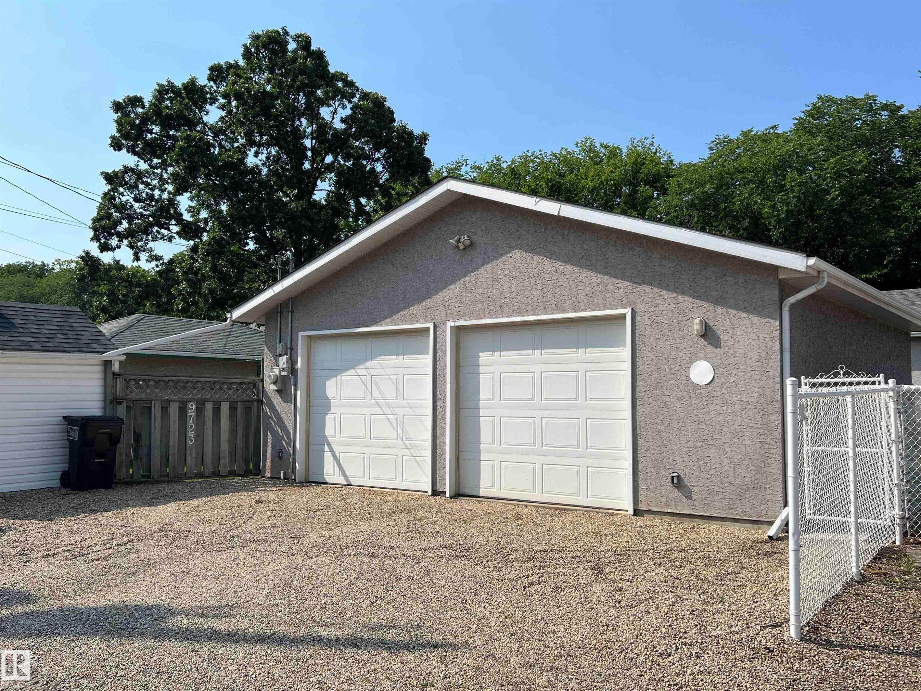 Detached two-car garage with stucco exterior and panel-style doors - 9723 65 Avenue Nw, Edmonton, AB