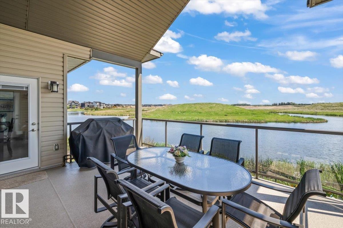 87 Lakeland Crescent, Beaumont, AB - Outdoor With Body Of Water With Deck Patio Veranda With View With Exterior