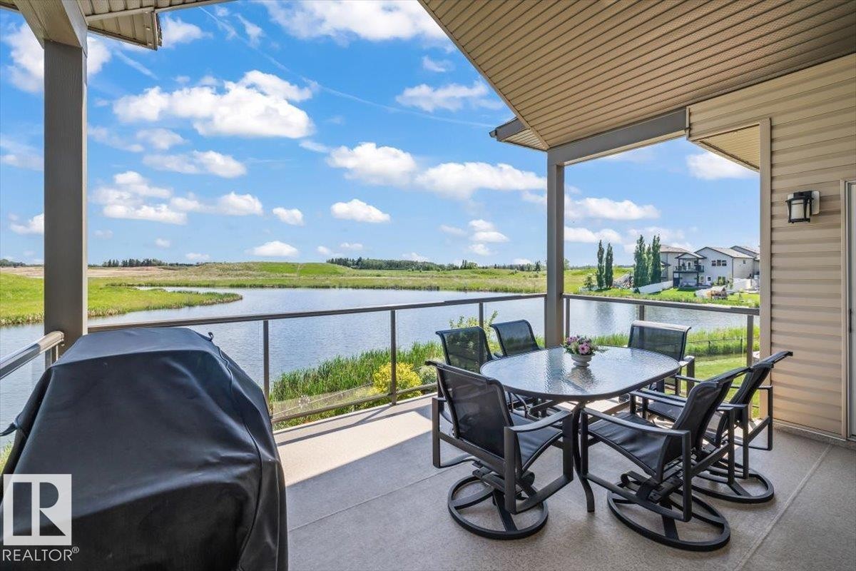 87 Lakeland Crescent, Beaumont, AB - Outdoor With Body Of Water With Deck Patio Veranda With View With Exterior