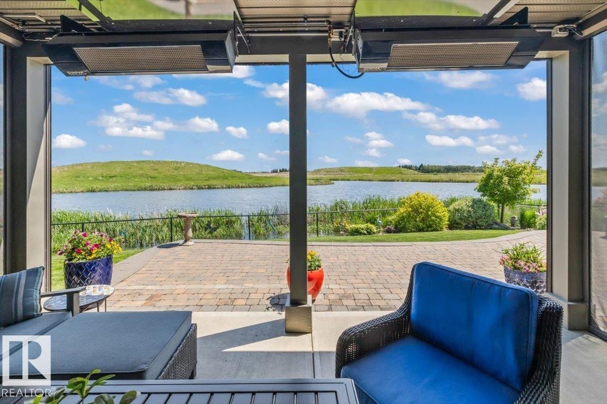 87 Lakeland Crescent, Beaumont, AB - Outdoor With Body Of Water With Deck Patio Veranda With View With Exterior