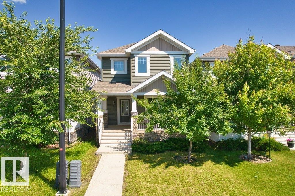 Two-story residence featuring dark green siding and white trim - 1627 167 Street Sw, Edmonton, AB - Outdoor
