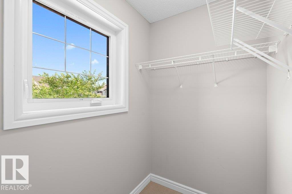 Windowed closet space featuring white wire shelving - 1627 167 Street Sw, Edmonton, AB - Indoor