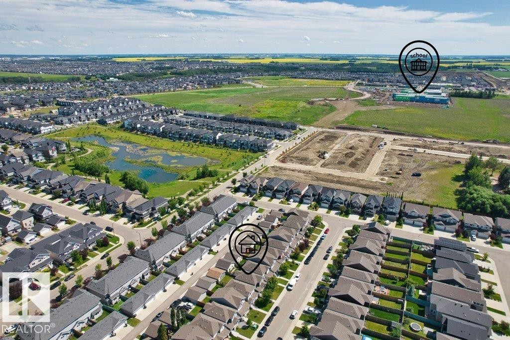 Aerial perspective showcasing a residential community with varied housing styles - 1627 167 Street Sw, Edmonton, AB - Outdoor With View