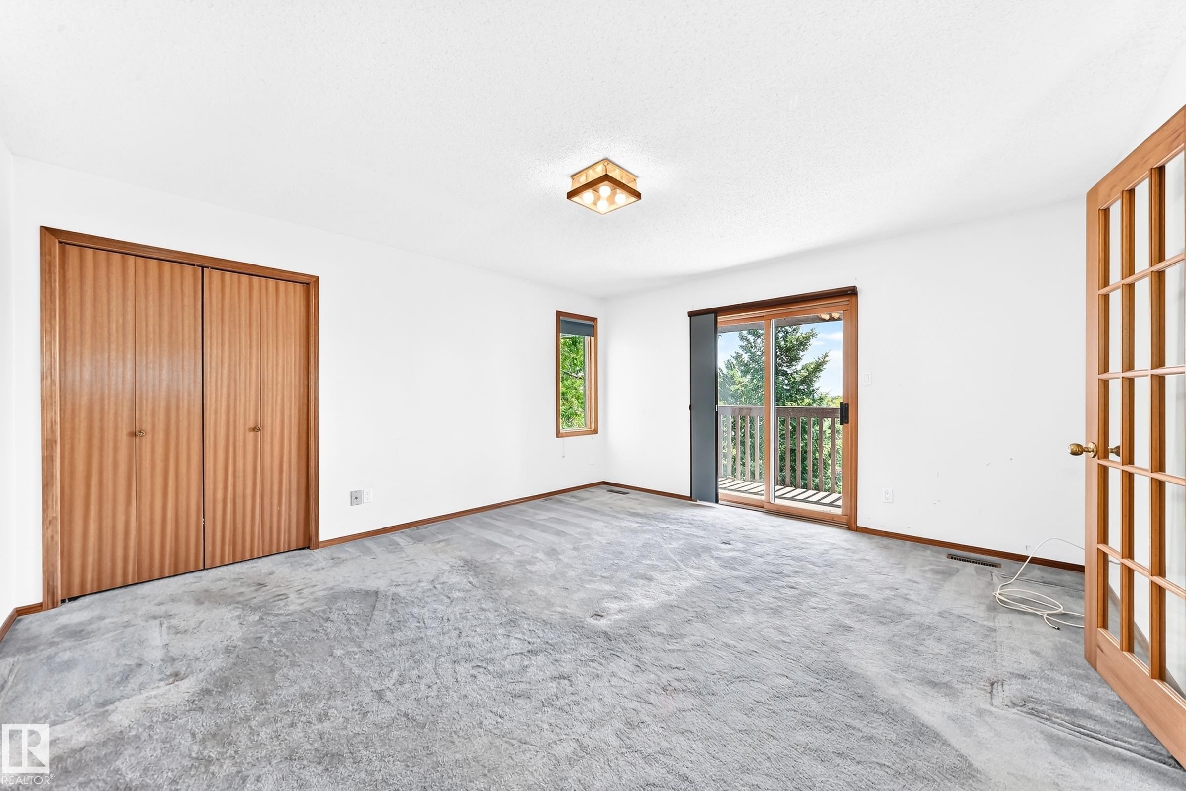 Room featuring light-colored walls and gray carpeting - 4208 Ramsay Road Nw, Edmonton, AB - Indoor Photo Showing Other Room
