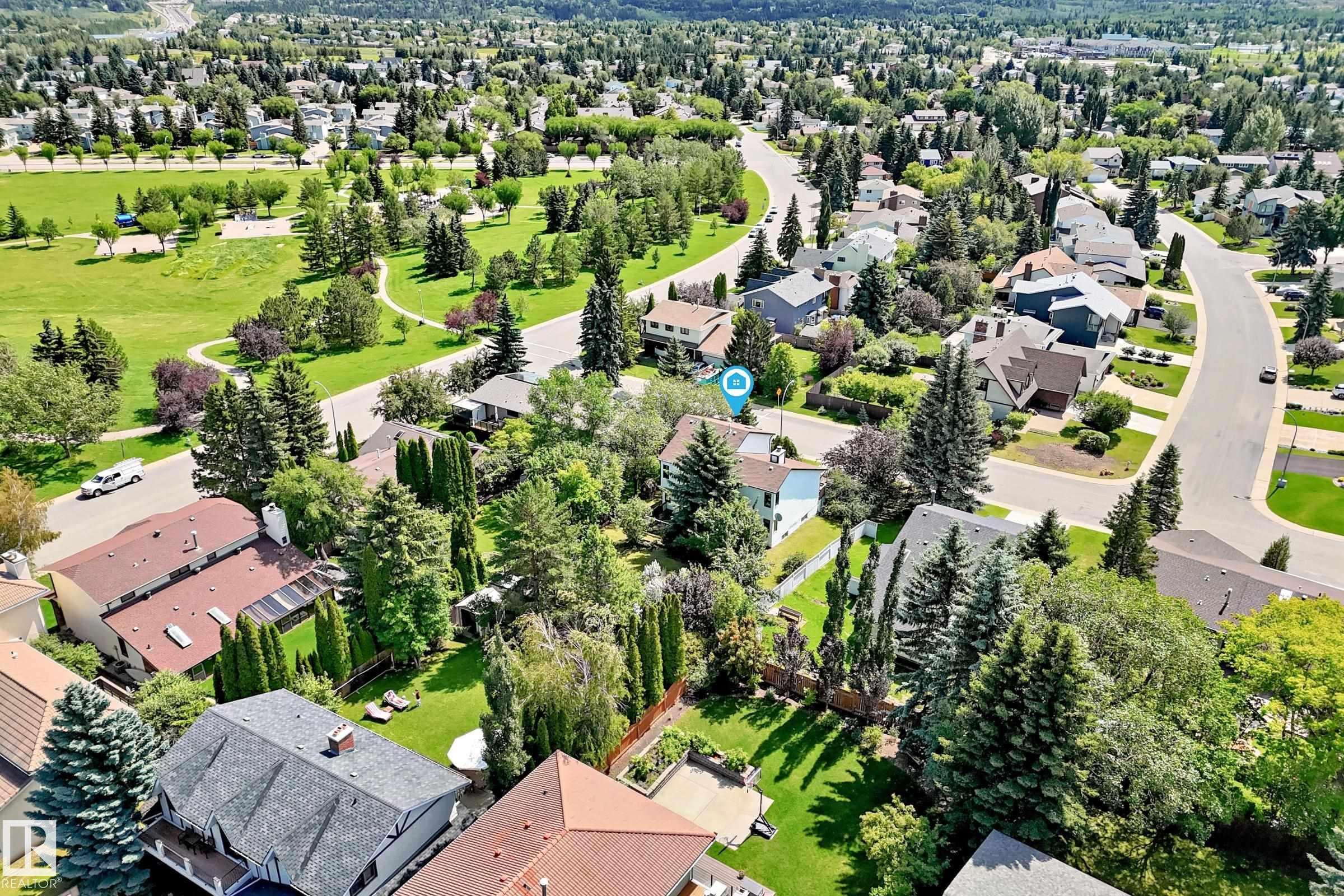Expansive aerial view showcasing a residential neighborhood with verdant landscaping and mature trees - 4208 Ramsay Road Nw, Edmonton, AB - Outdoor With View