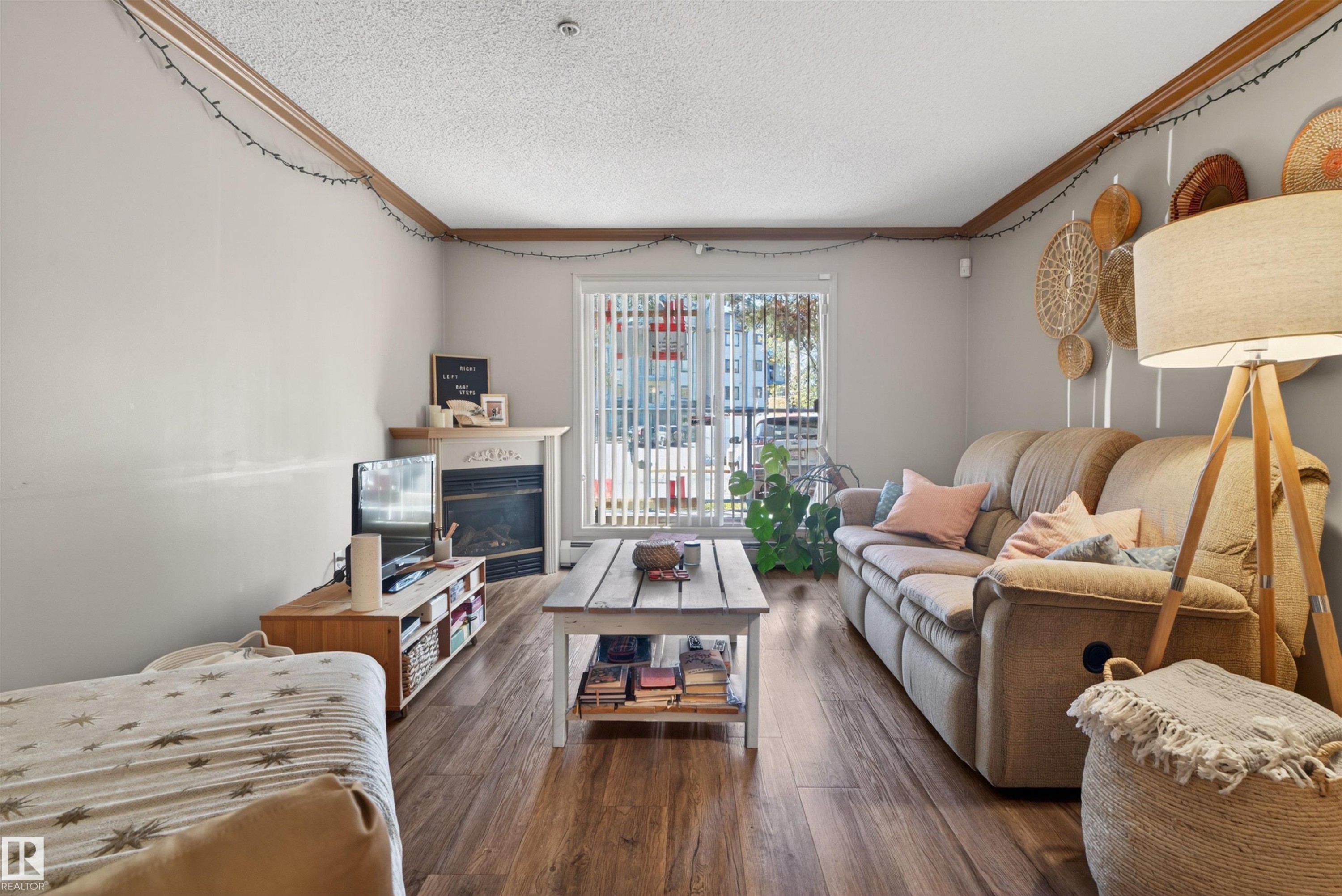 #110 2903 Rabbit Hill Rd Nw, Edmonton, AB - Indoor Photo Showing Living Room With Fireplace