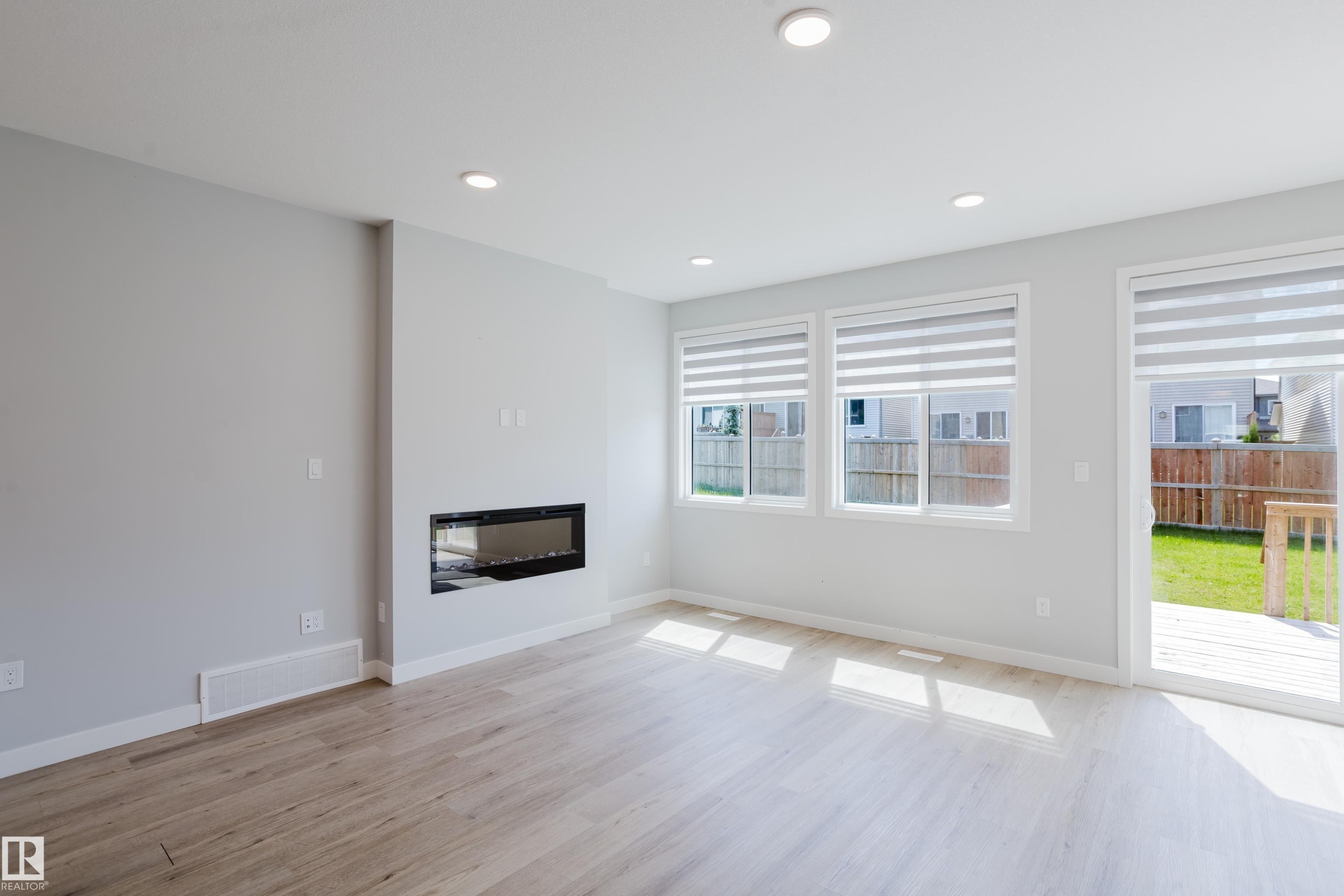 3883 Chrustawka Place Sw, Edmonton, AB - Indoor Photo Showing Living Room With Fireplace