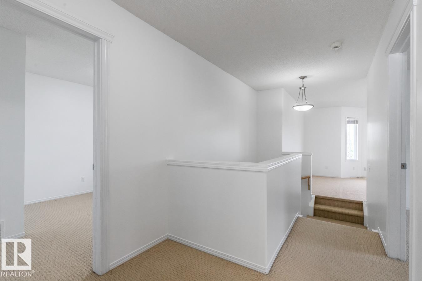 Hallway On The Upper Floor. One Way To The Family Room And The Other To The Bedrooms. - 4717 60 Street, Beaumont, AB