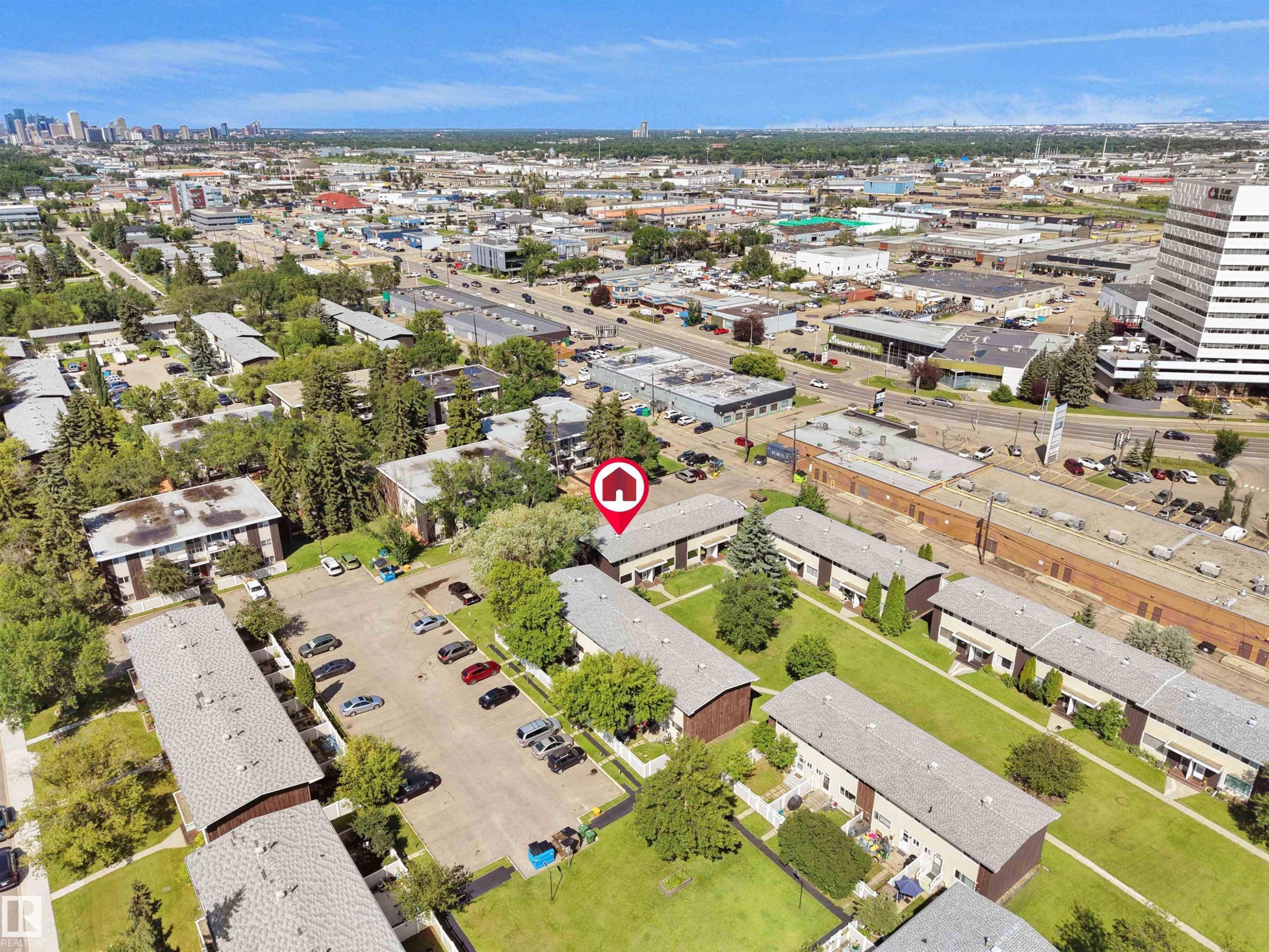 Aerial view showcasing multiple residential buildings with surrounding green spaces - 10446 55 Avenue Nw, Edmonton, AB - Outdoor With View
