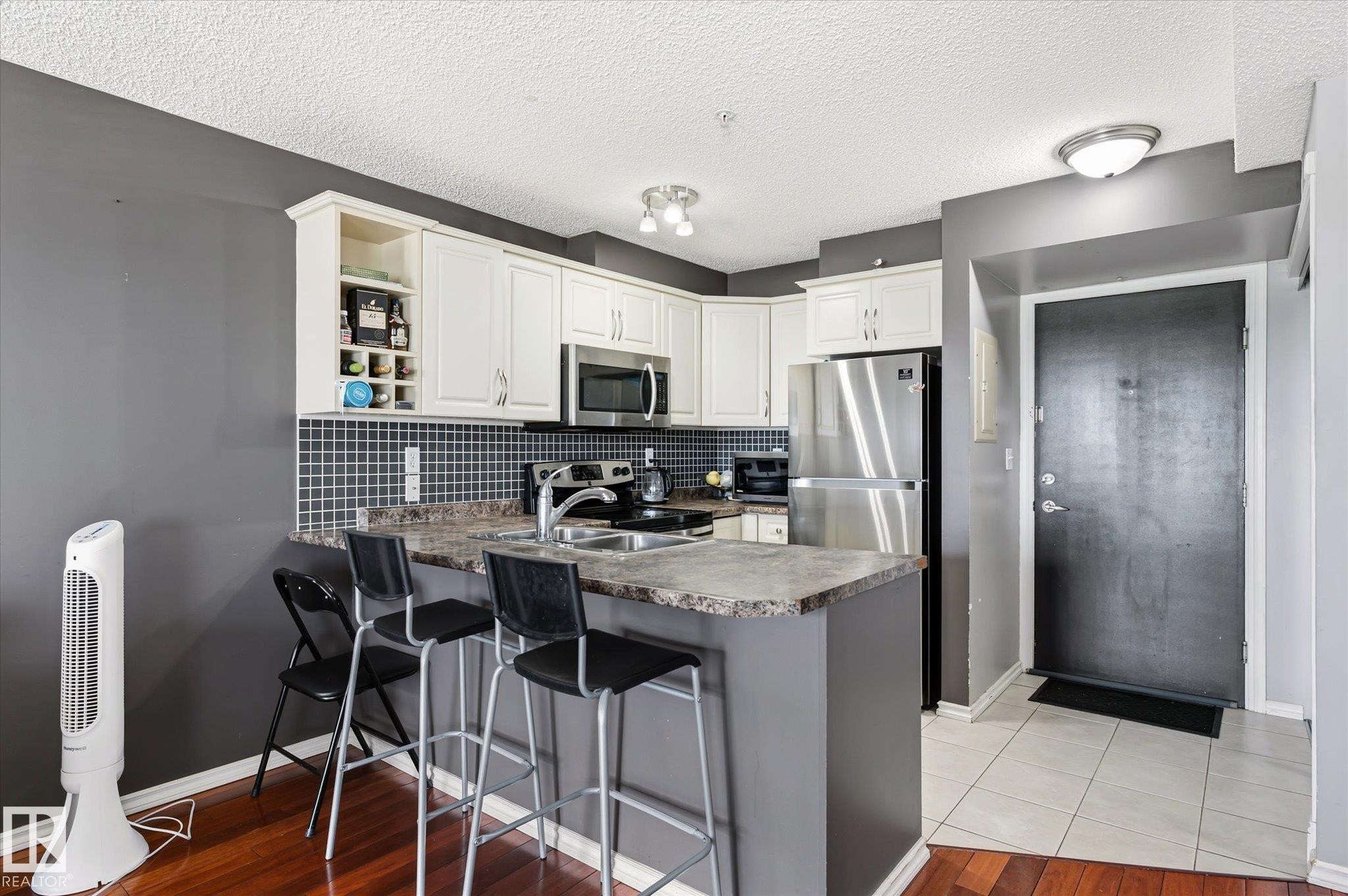 #418 17404 64 Av Nw, Edmonton, AB - Indoor Photo Showing Kitchen With Double Sink