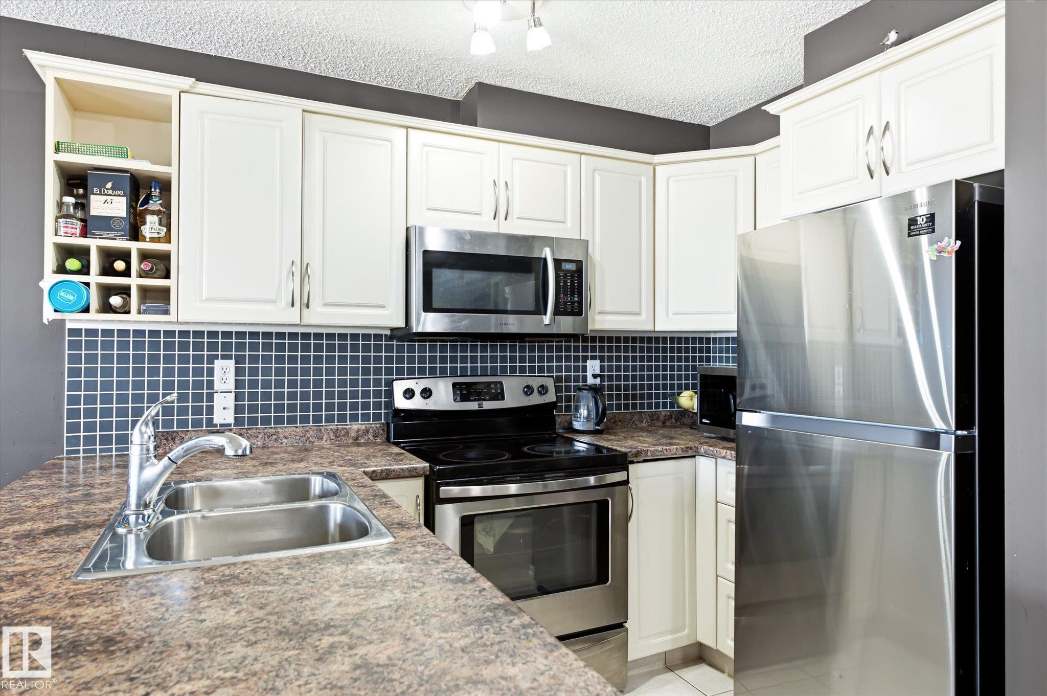 #418 17404 64 Av Nw, Edmonton, AB - Indoor Photo Showing Kitchen With Double Sink With Upgraded Kitchen
