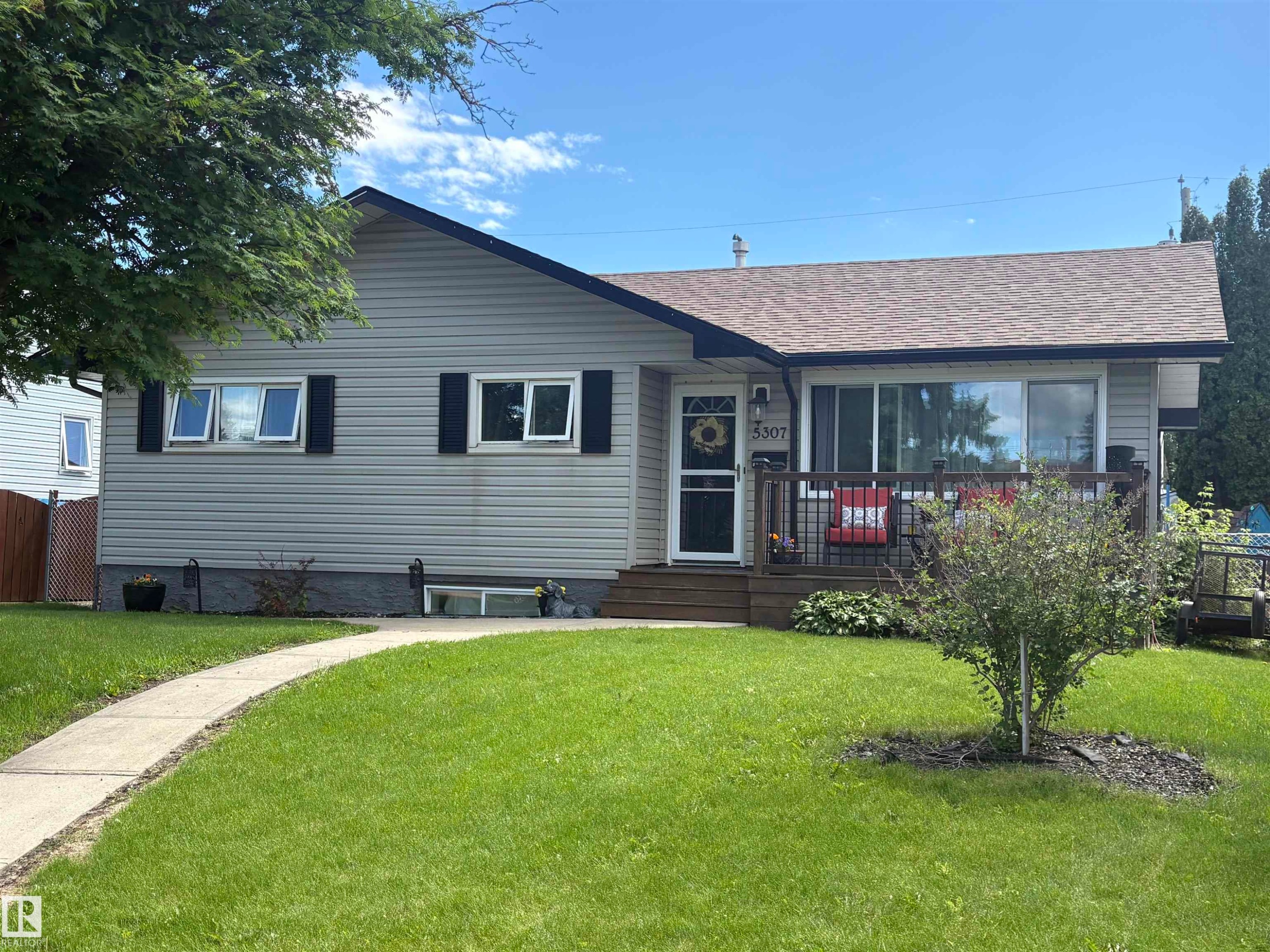 Light gray siding exterior with black shutters and a brown shingle roof - 5307 104 Avenue Nw, Edmonton, AB - Outdoor