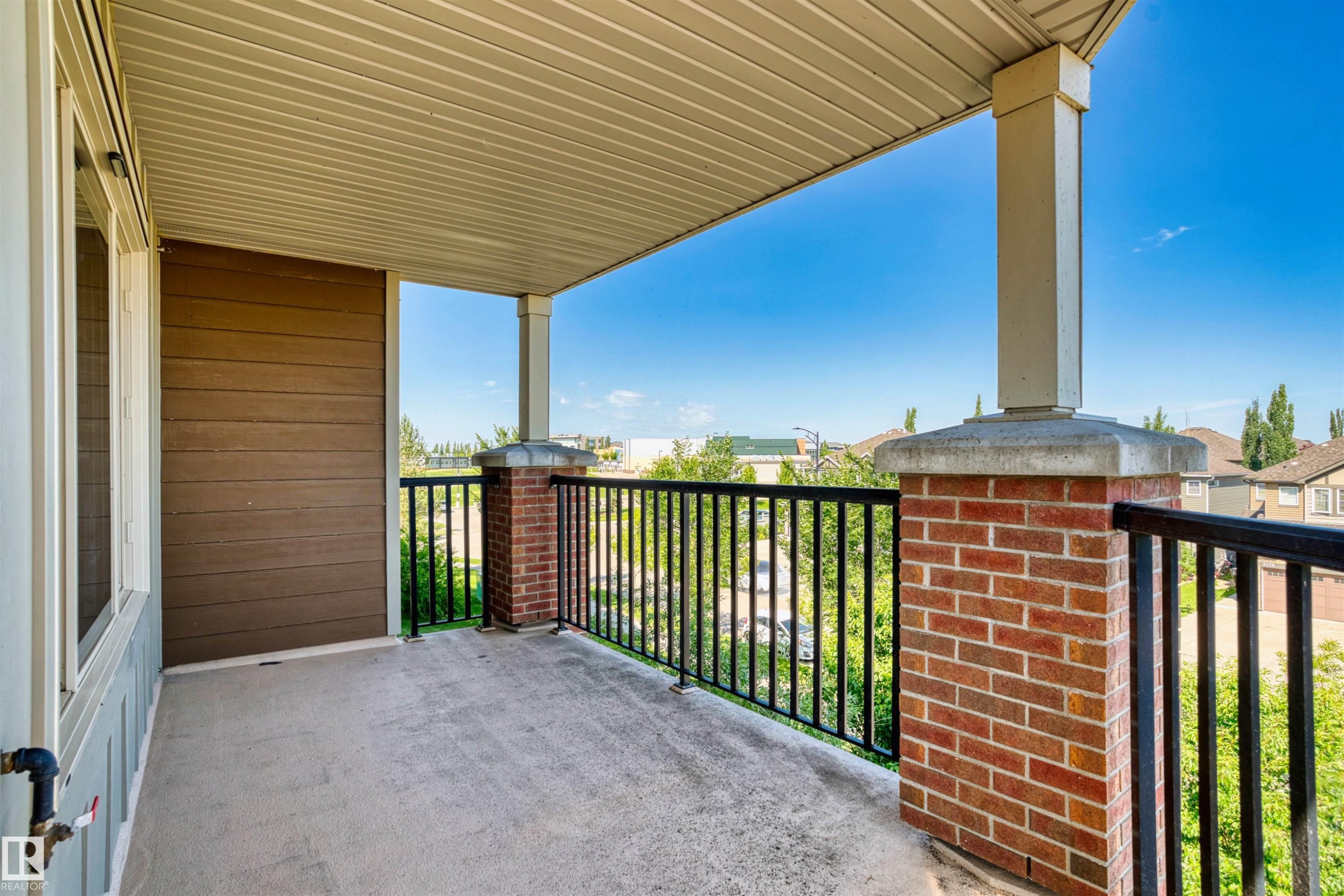 Covered balcony with concrete flooring - #317 3719 Whitelaw Ln Nw, Edmonton, AB - Outdoor With Exterior