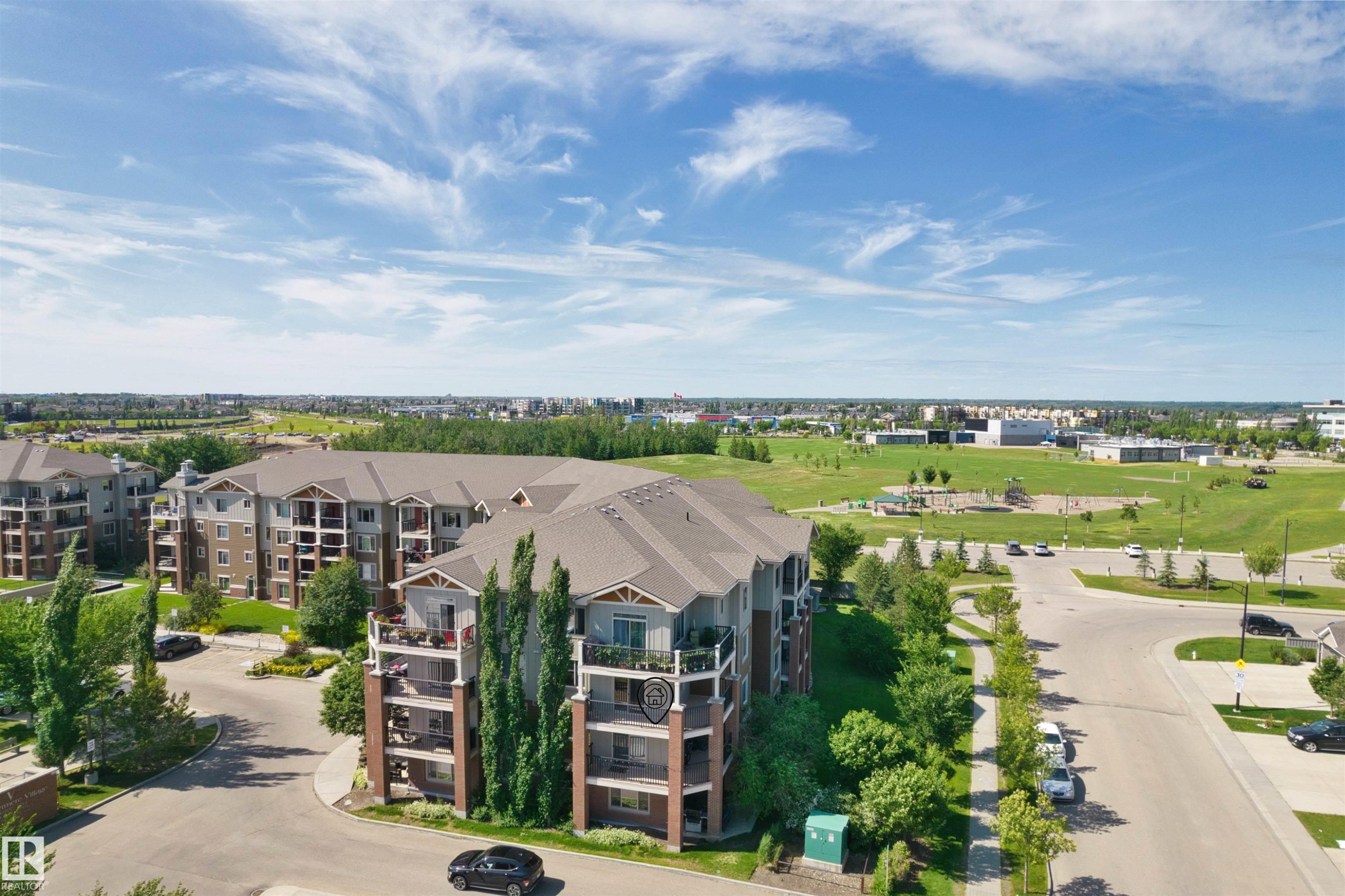 Multi-story residential buildings featuring gabled roofs and private balconies - #317 3719 Whitelaw Ln Nw, Edmonton, AB - Outdoor With View