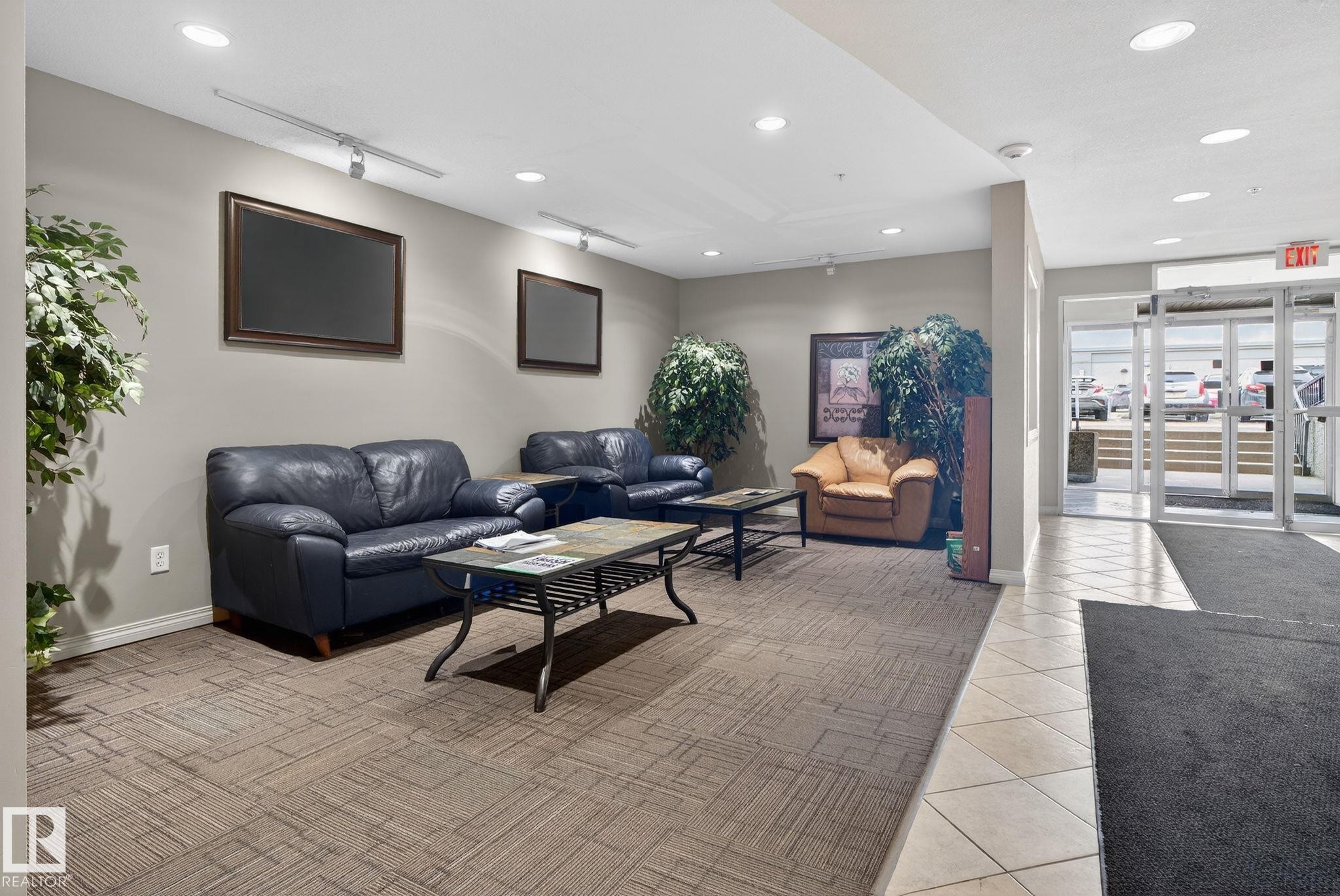Spacious common area featuring recessed lighting and track lighting fixtures - 423 2430 Guardian Road, Edmonton, AB - Indoor