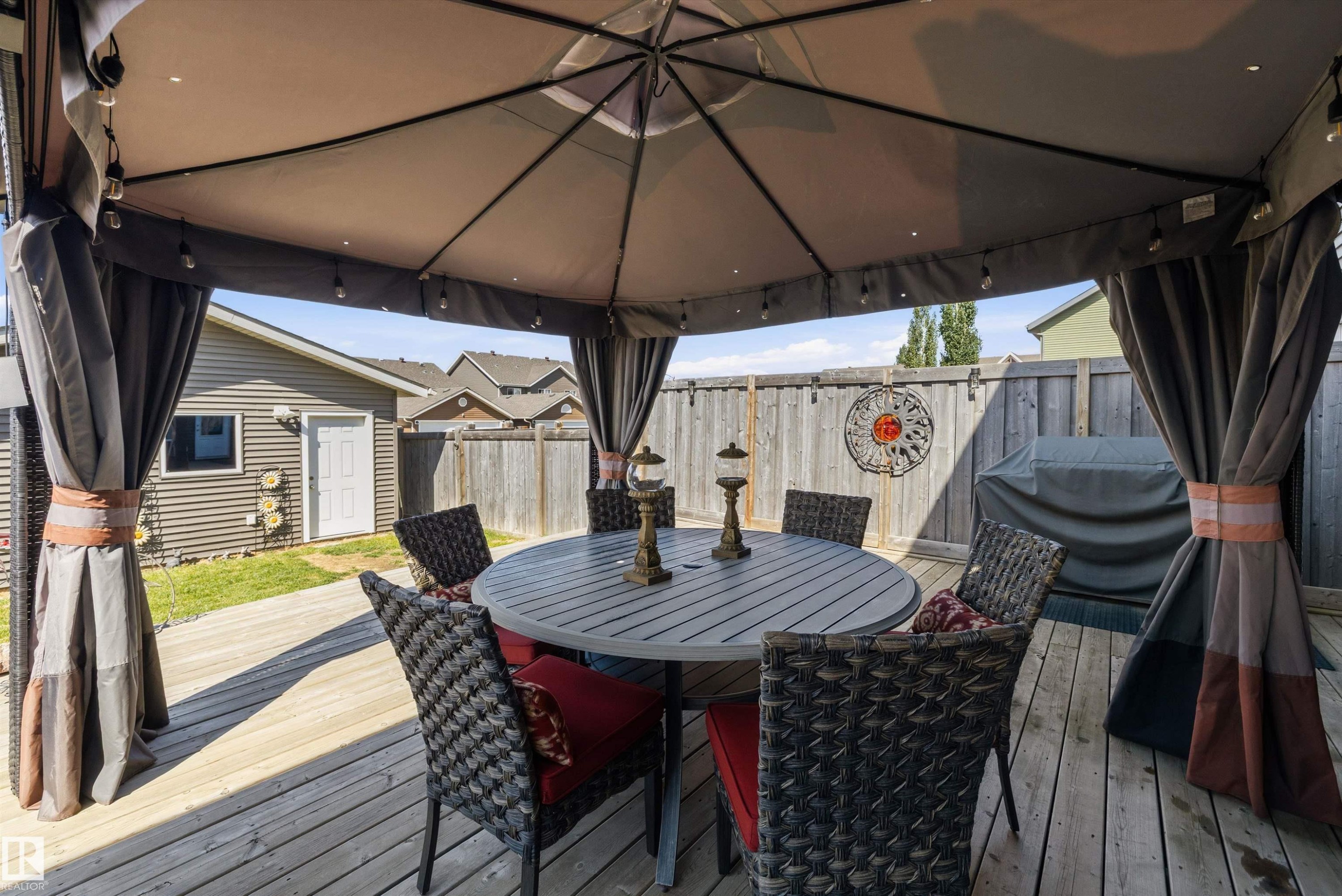 Expansive outdoor deck featuring a gazebo with integrated lighting - 4688 Crabapple Run Sw, Edmonton, AB - Outdoor With Deck Patio Veranda With Exterior