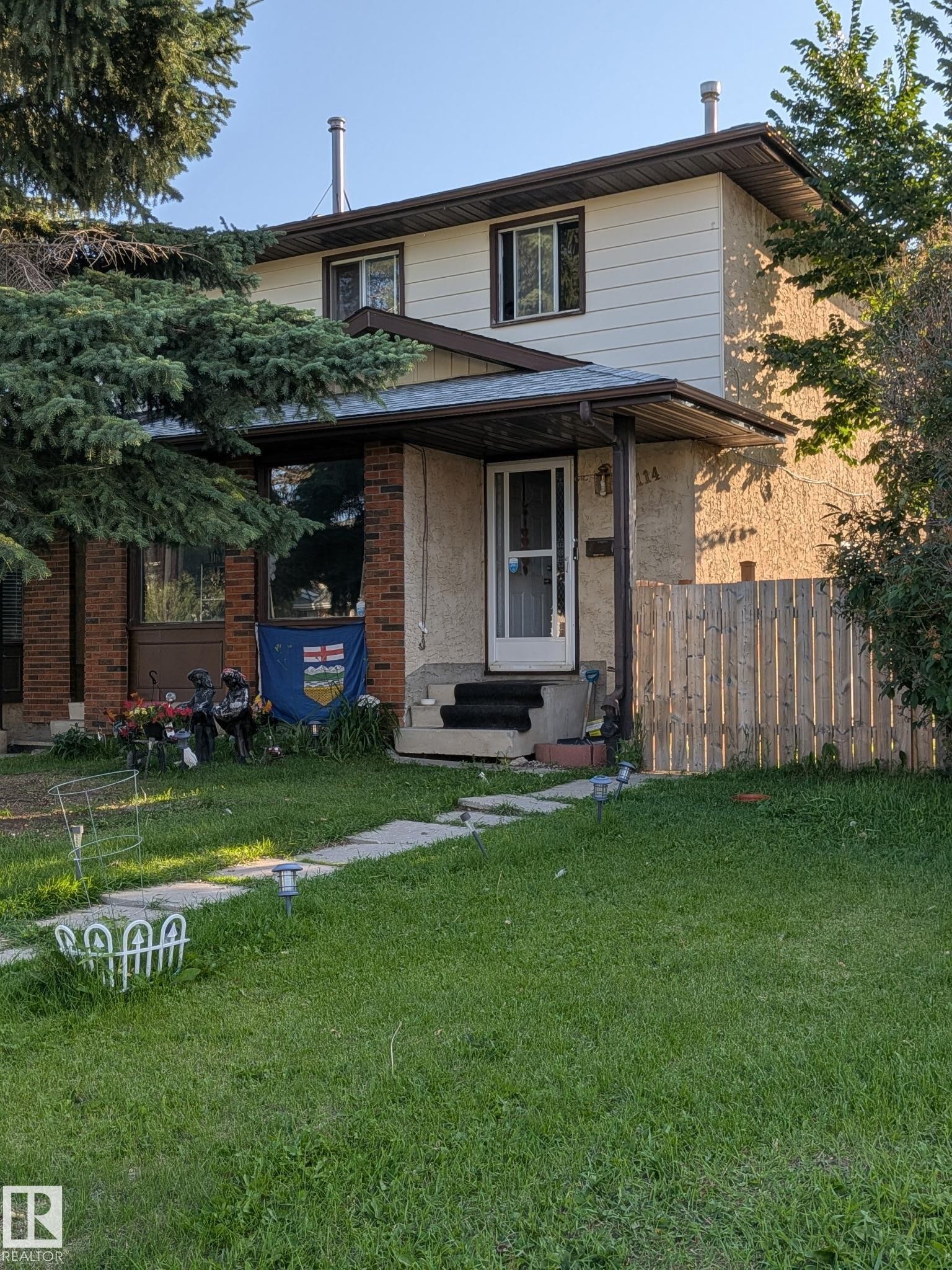 Two-story residence featuring light-colored siding and brick accents - 2114 47 Street Nw, Edmonton, AB - Outdoor