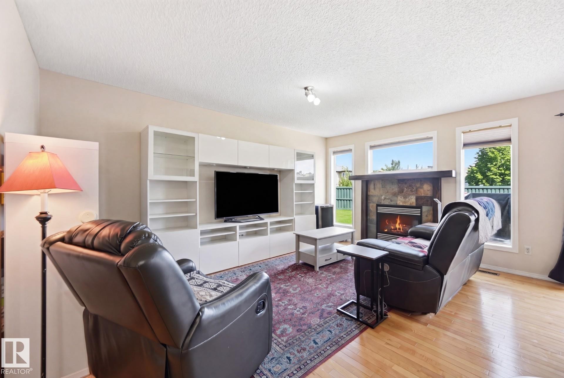 1867 119 Street Sw, Edmonton, AB - Indoor Photo Showing Living Room With Fireplace