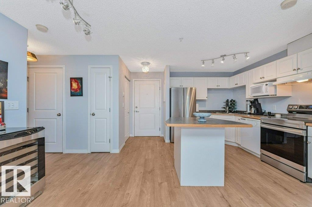 #217 245 Edwards Dr Sw, Edmonton, AB - Indoor Photo Showing Kitchen With Stainless Steel Kitchen