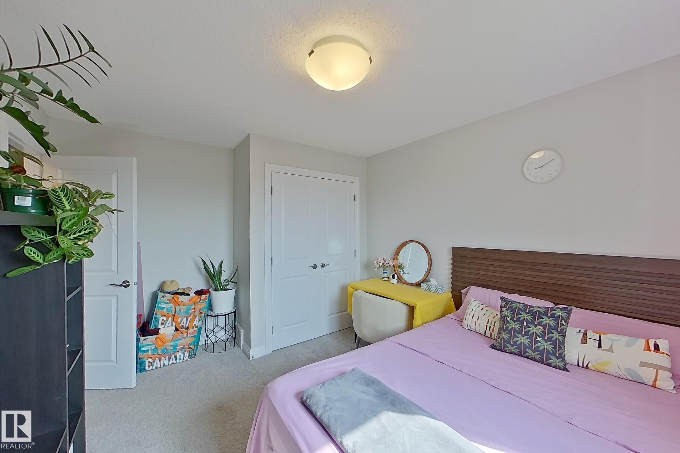 Light gray wall paint, white trim, and light-colored carpeting create a neutral palette - 491 Ebbers Way, Edmonton, AB