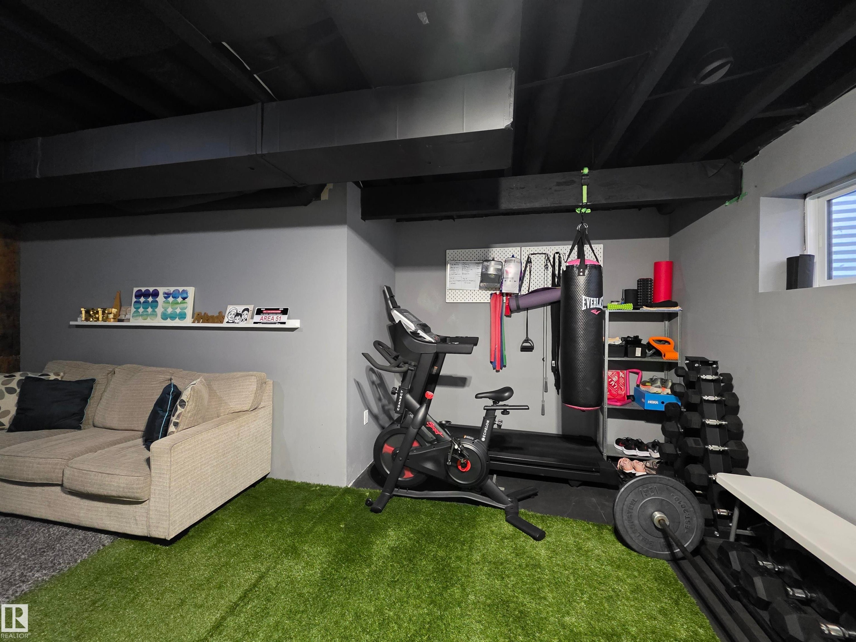 Dedicated recreational space featuring a combination of soft and artificial turf flooring - 491 Ebbers Way, Edmonton, AB