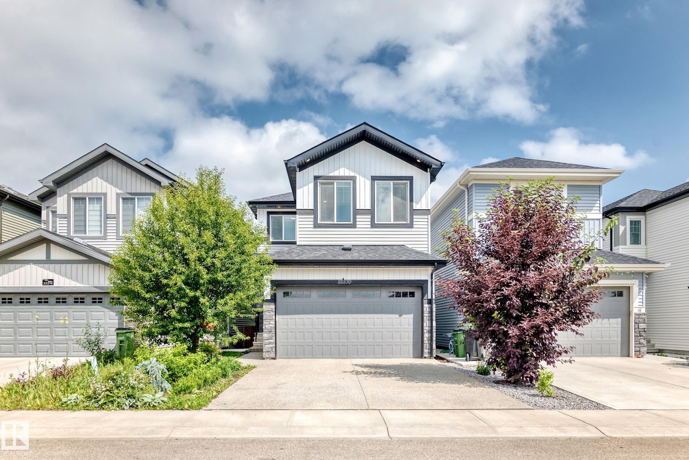 Two-story home featuring a combination of horizontal siding and vertical board and batten siding - 22270 99A Avenue Nw, Edmonton, AB - Outdoor With Facade