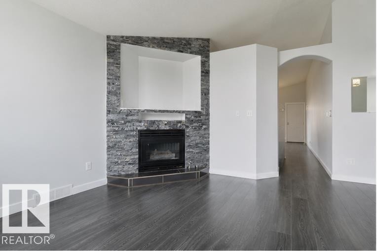 417 Hollick-Kenyon Road Nw, Edmonton, AB - Indoor Photo Showing Living Room With Fireplace