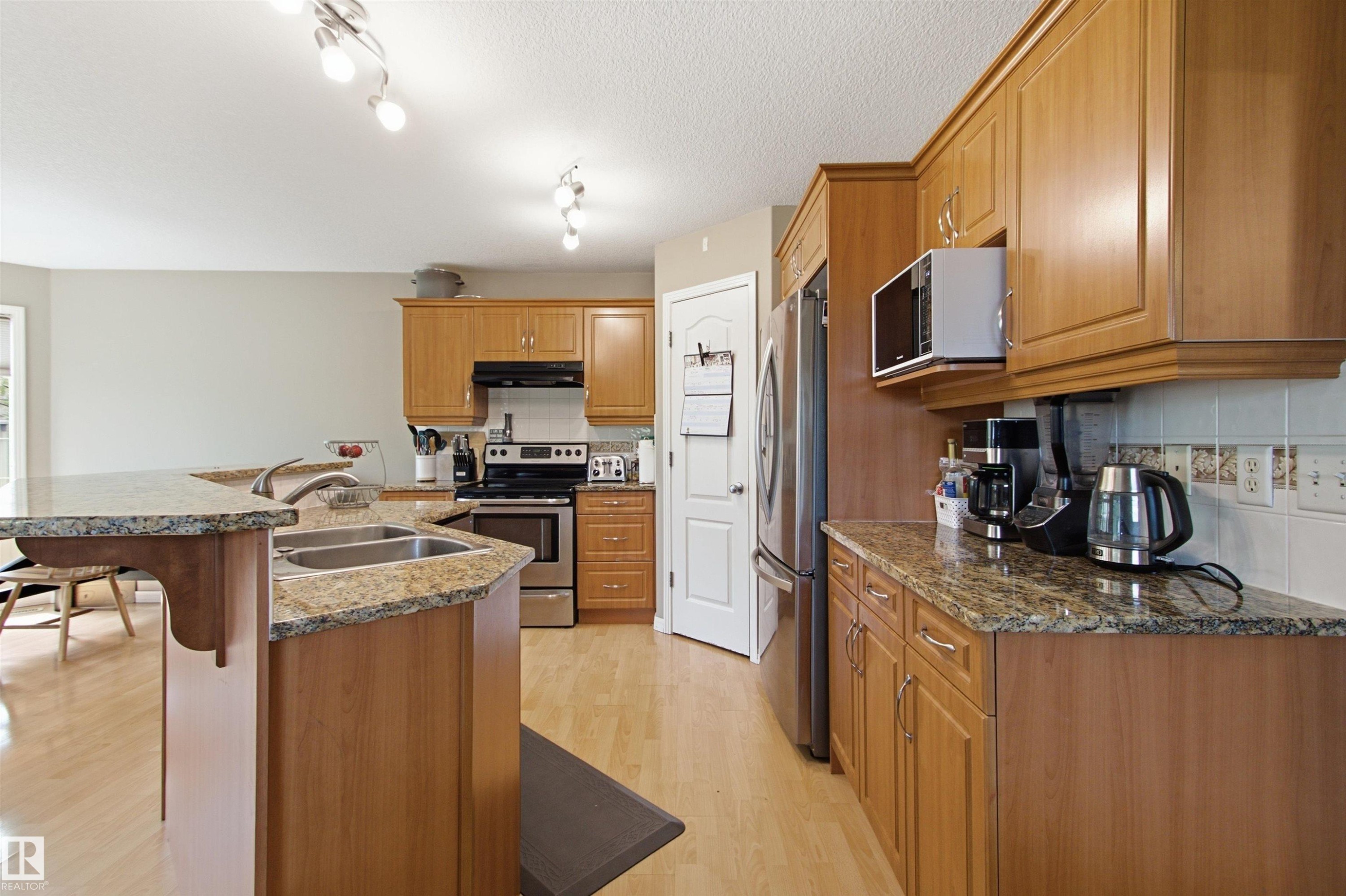 8203 5 Avenue Sw, Edmonton, AB - Indoor Photo Showing Kitchen With Double Sink