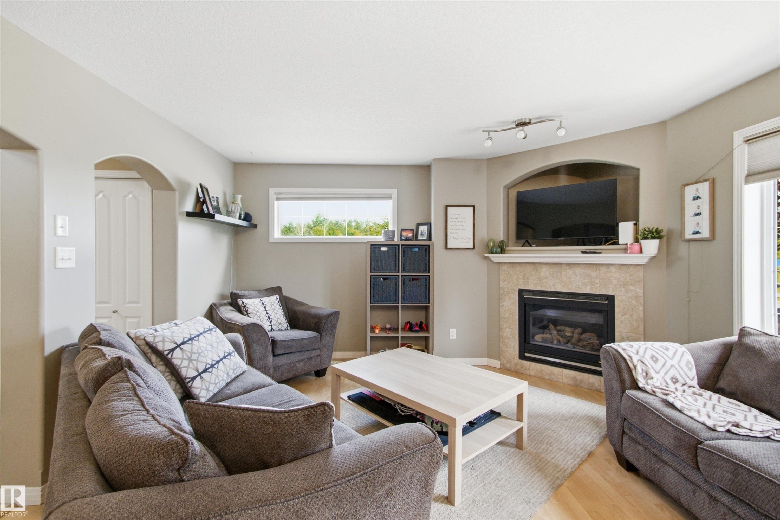 8203 5 Avenue Sw, Edmonton, AB - Indoor Photo Showing Living Room With Fireplace