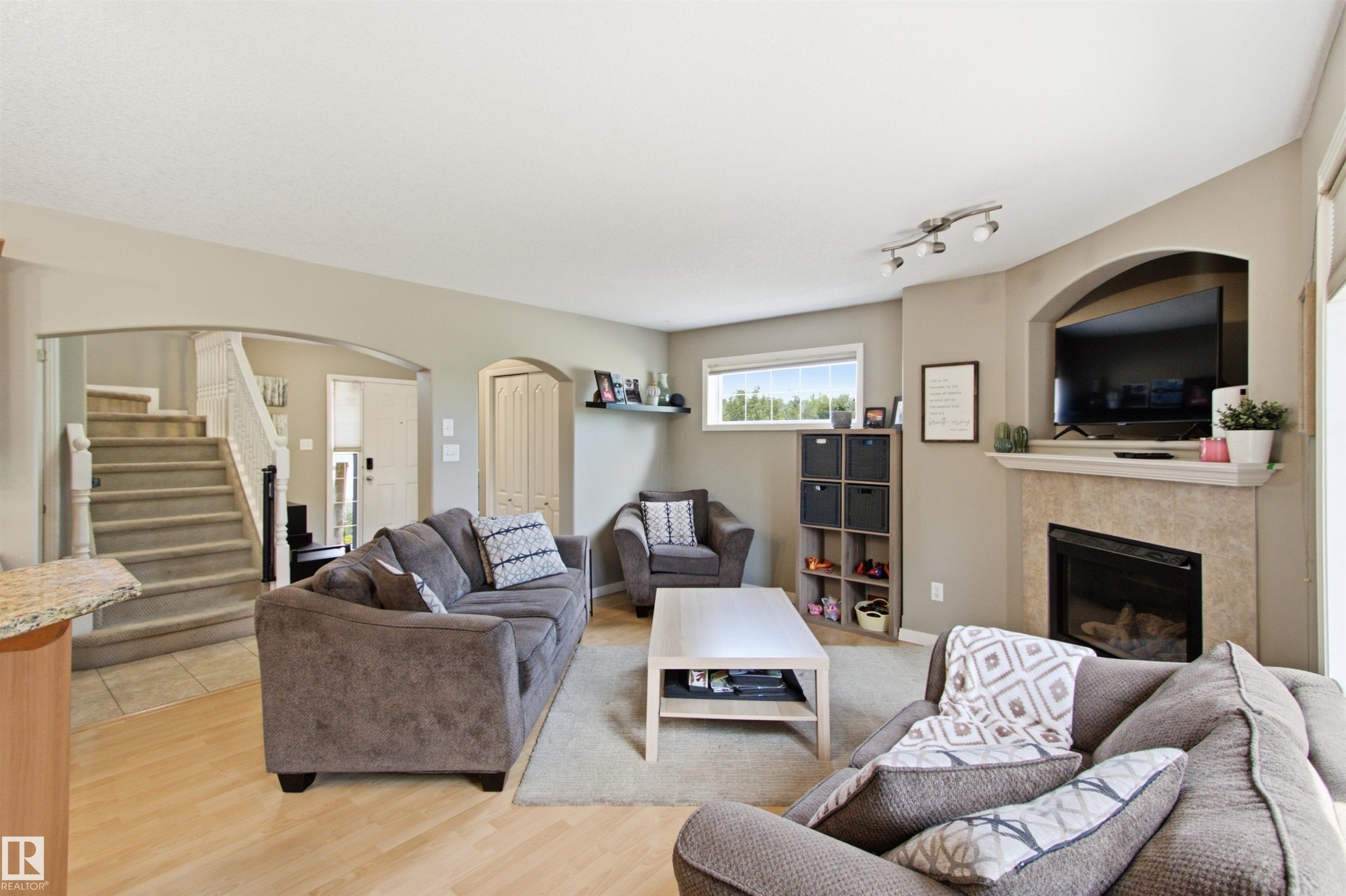 8203 5 Avenue Sw, Edmonton, AB - Indoor Photo Showing Living Room With Fireplace