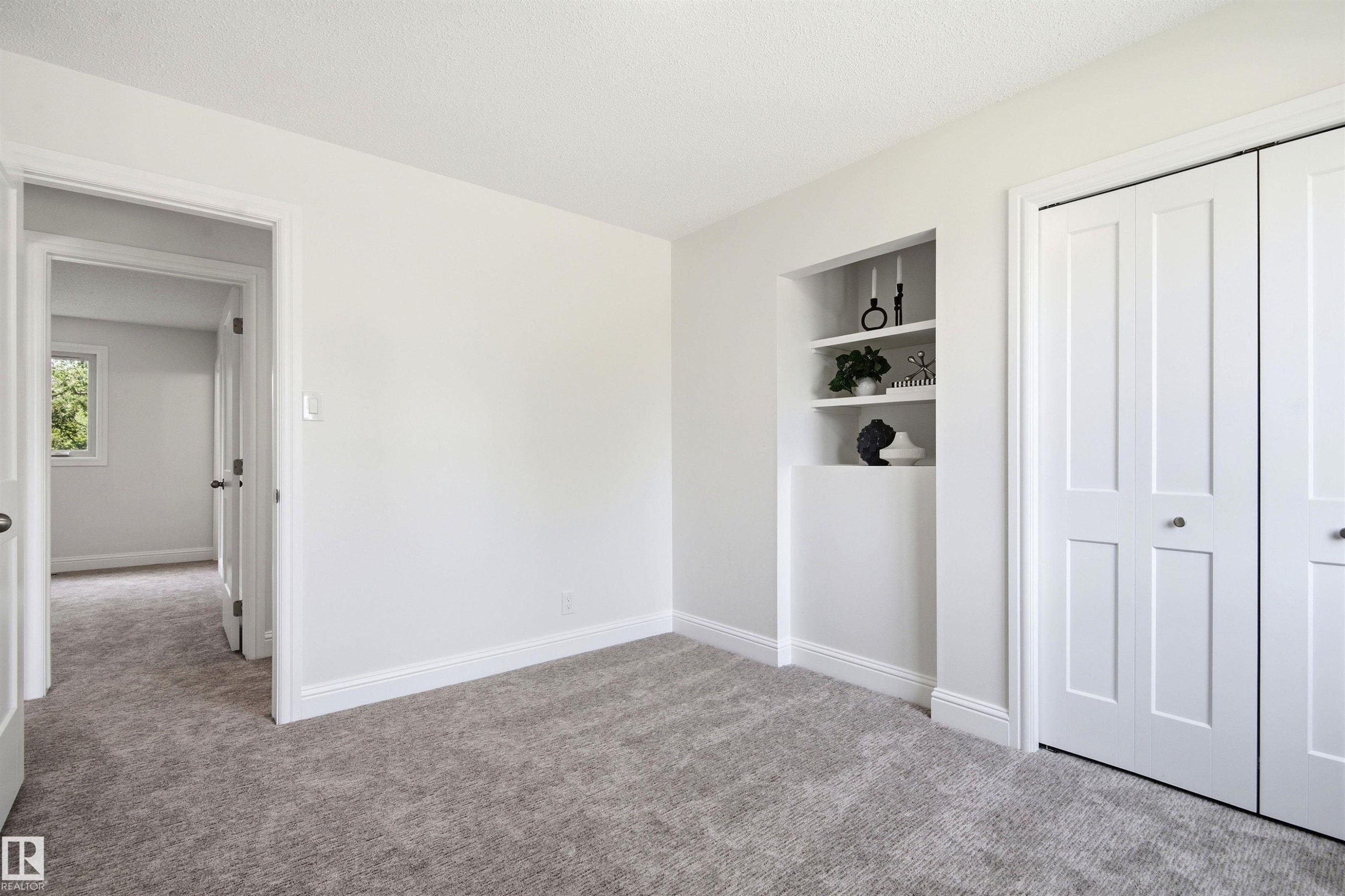 Light grey carpeting throughout, crisp white walls, and bright white baseboards - 14335 47 Avenue Nw, Edmonton, AB - Indoor Photo Showing Other Room